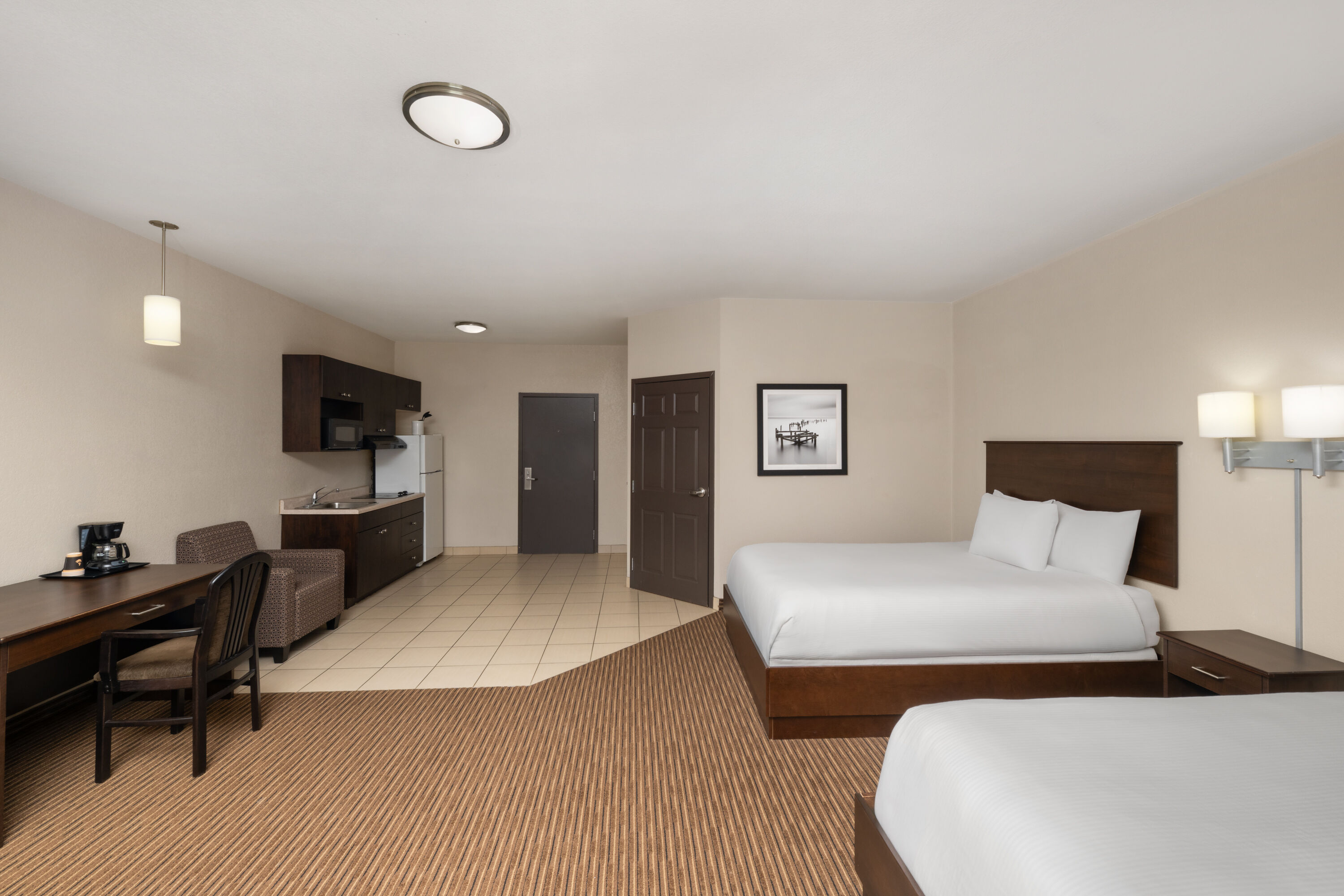 Guest room at the Travelodge Suites by Wyndham Estevan in Estevan, Saskatchewan