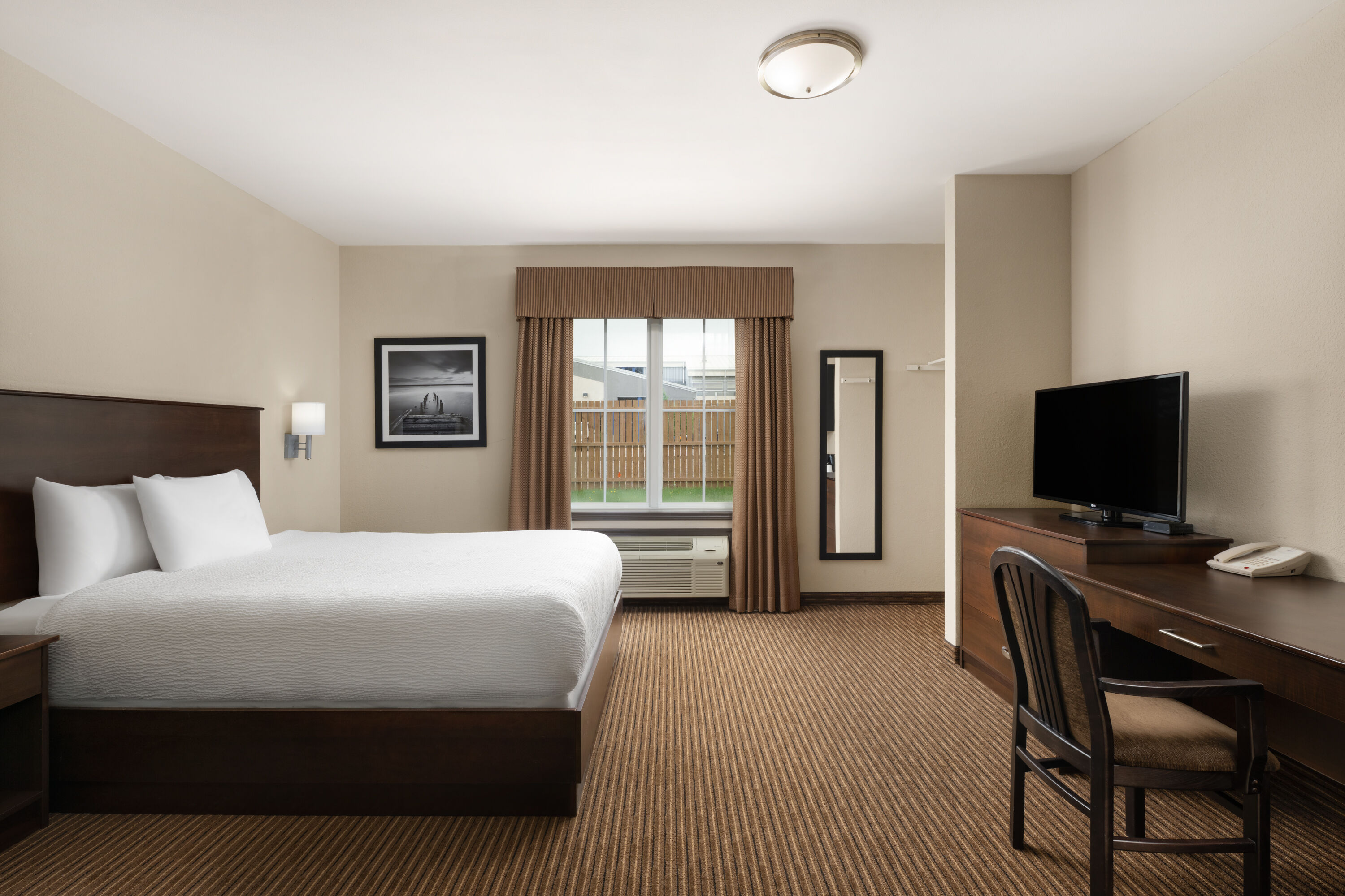 Guest room at the Travelodge Suites by Wyndham Estevan in Estevan, Saskatchewan