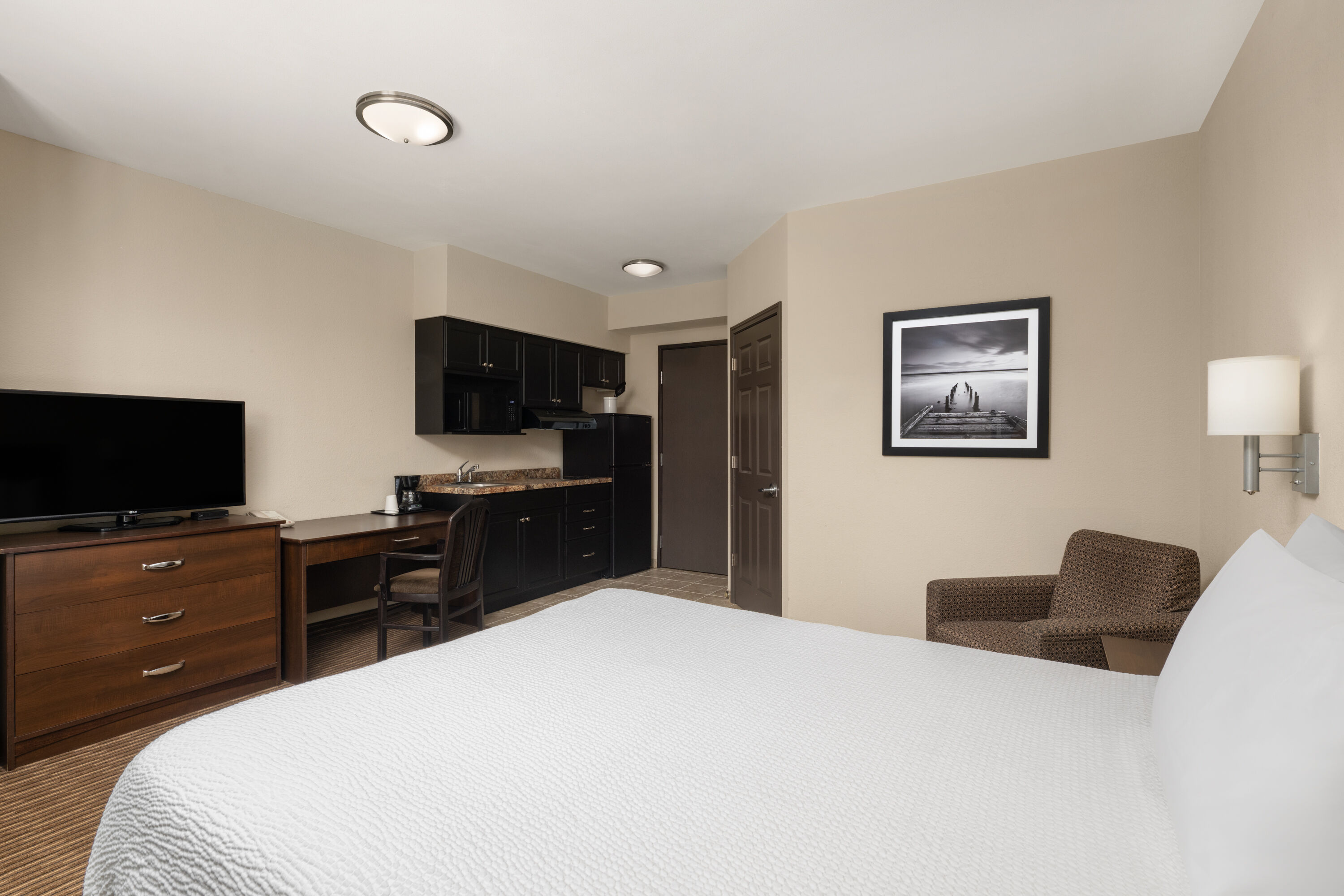 Guest room at the Travelodge Suites by Wyndham Estevan in Estevan, Saskatchewan