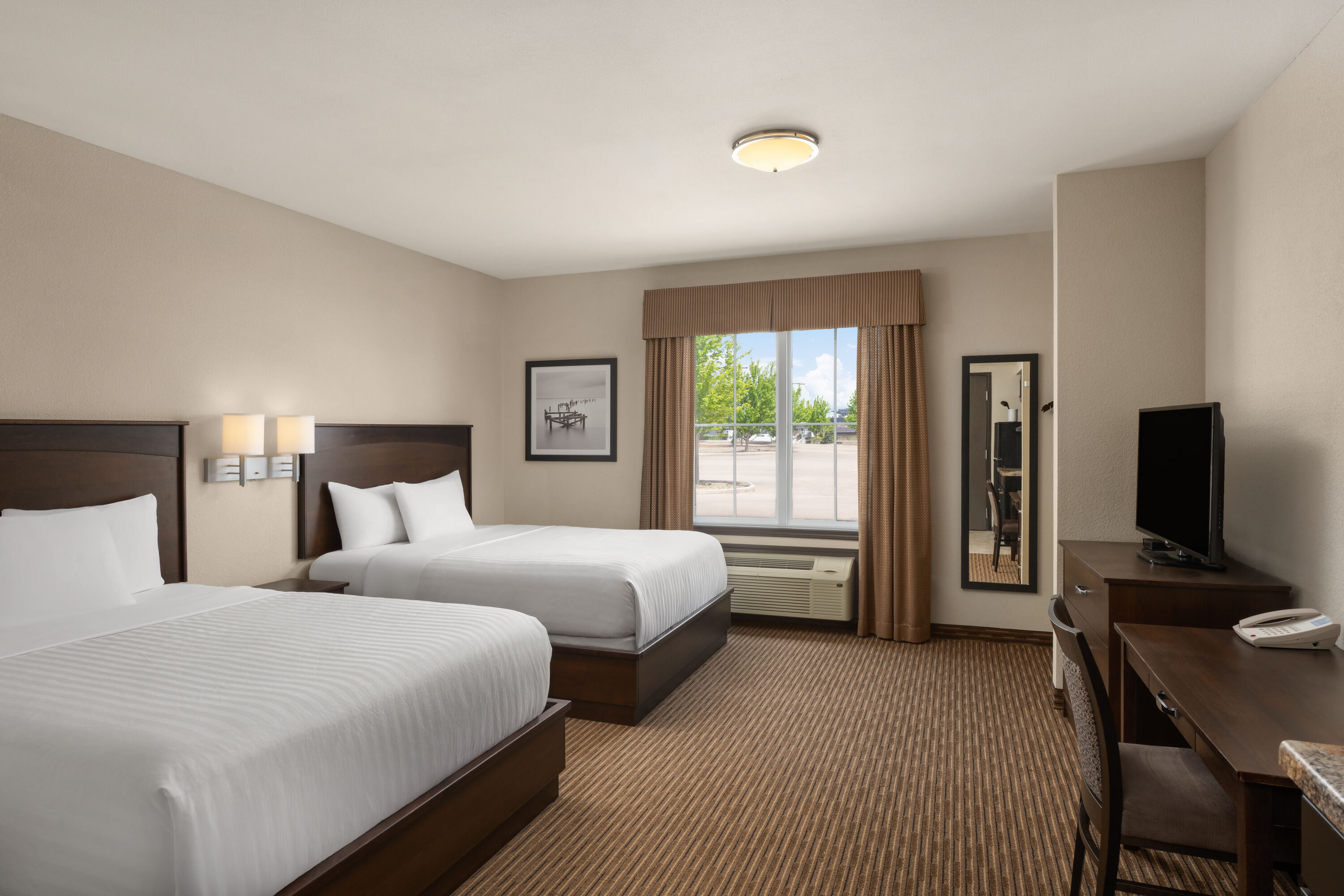 Guest room at the Travelodge Suites by Wyndham Estevan in Estevan, Saskatchewan
