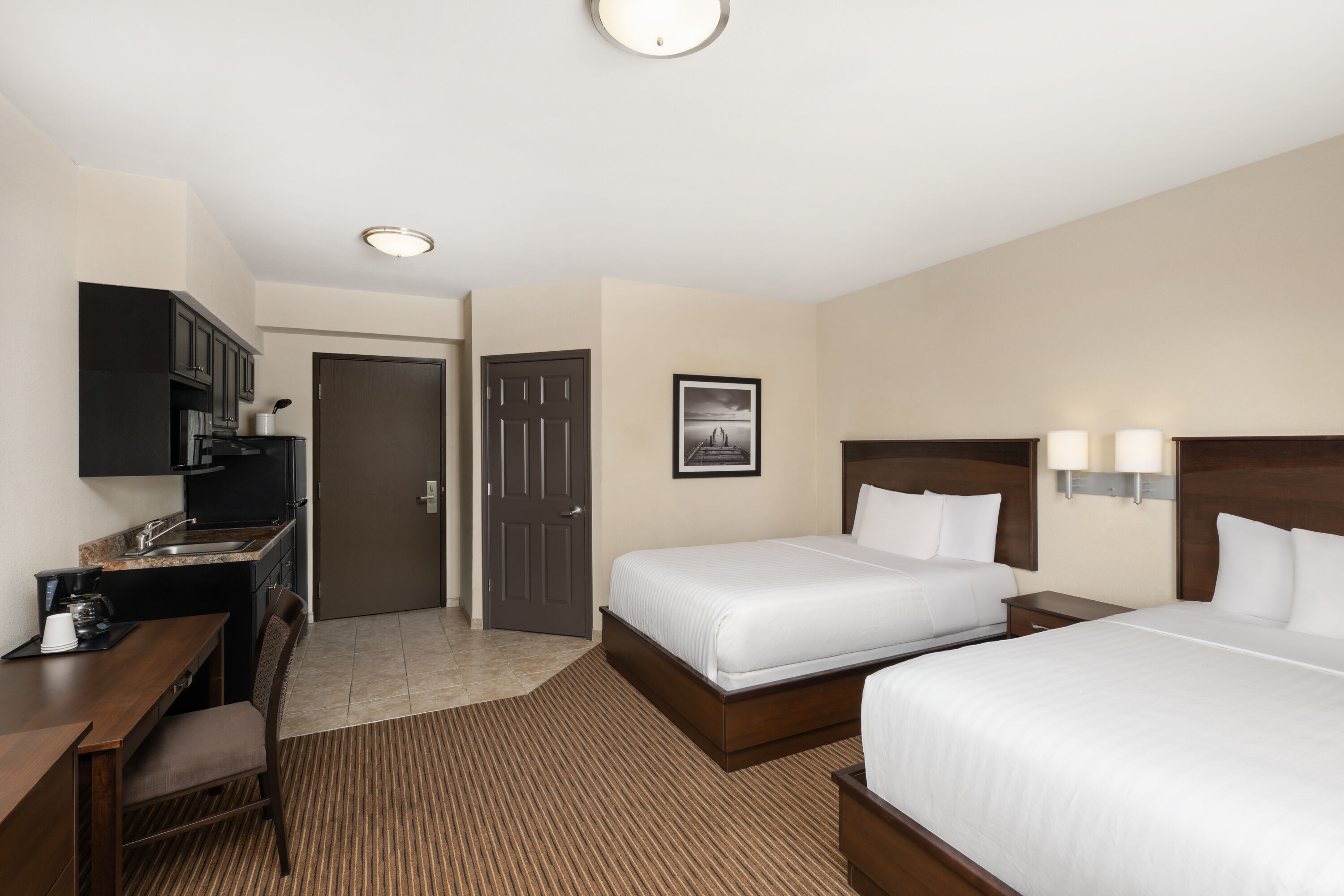 Guest room at the Travelodge Suites by Wyndham Estevan in Estevan, Saskatchewan