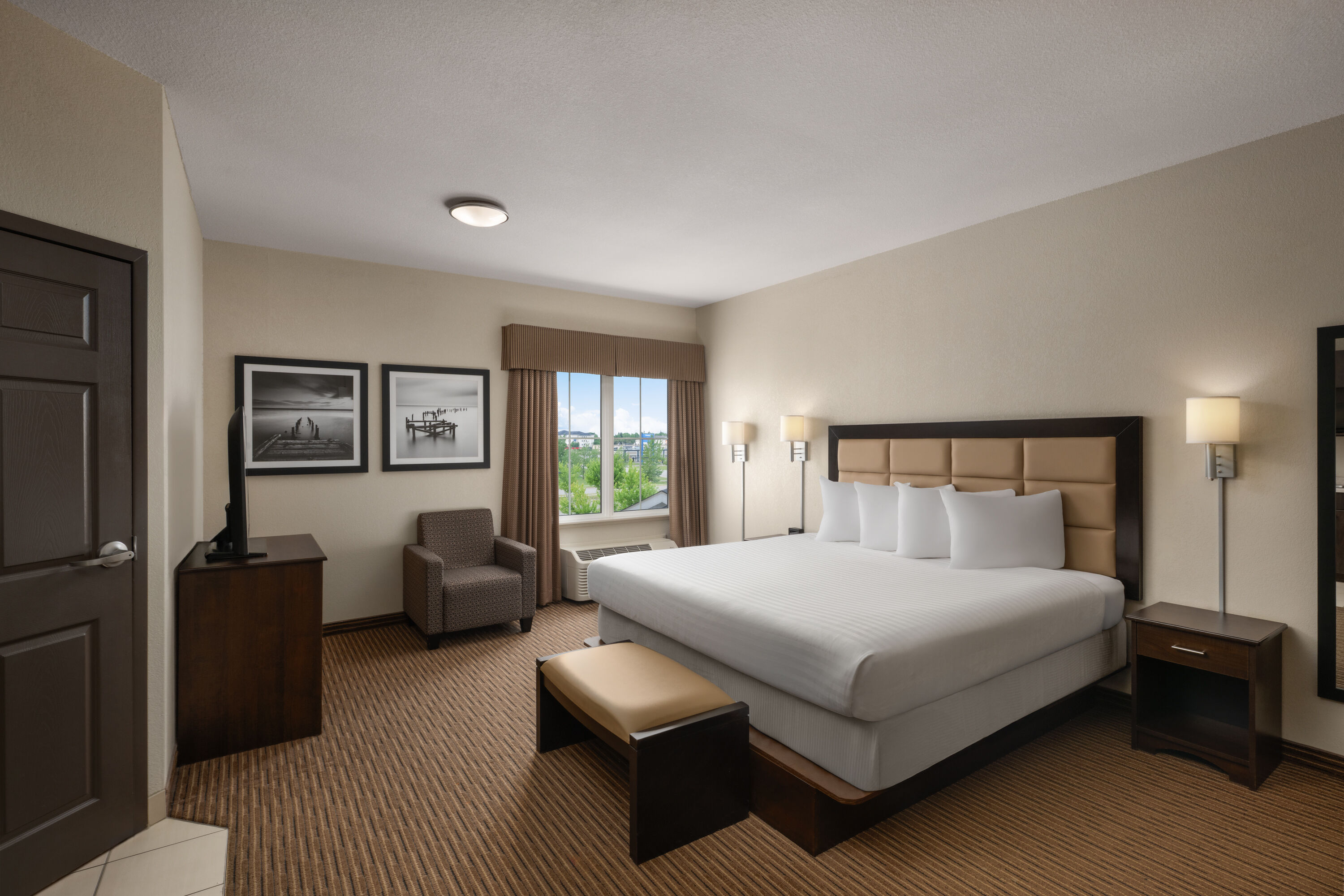Guest room at the Travelodge Suites by Wyndham Estevan in Estevan, Saskatchewan