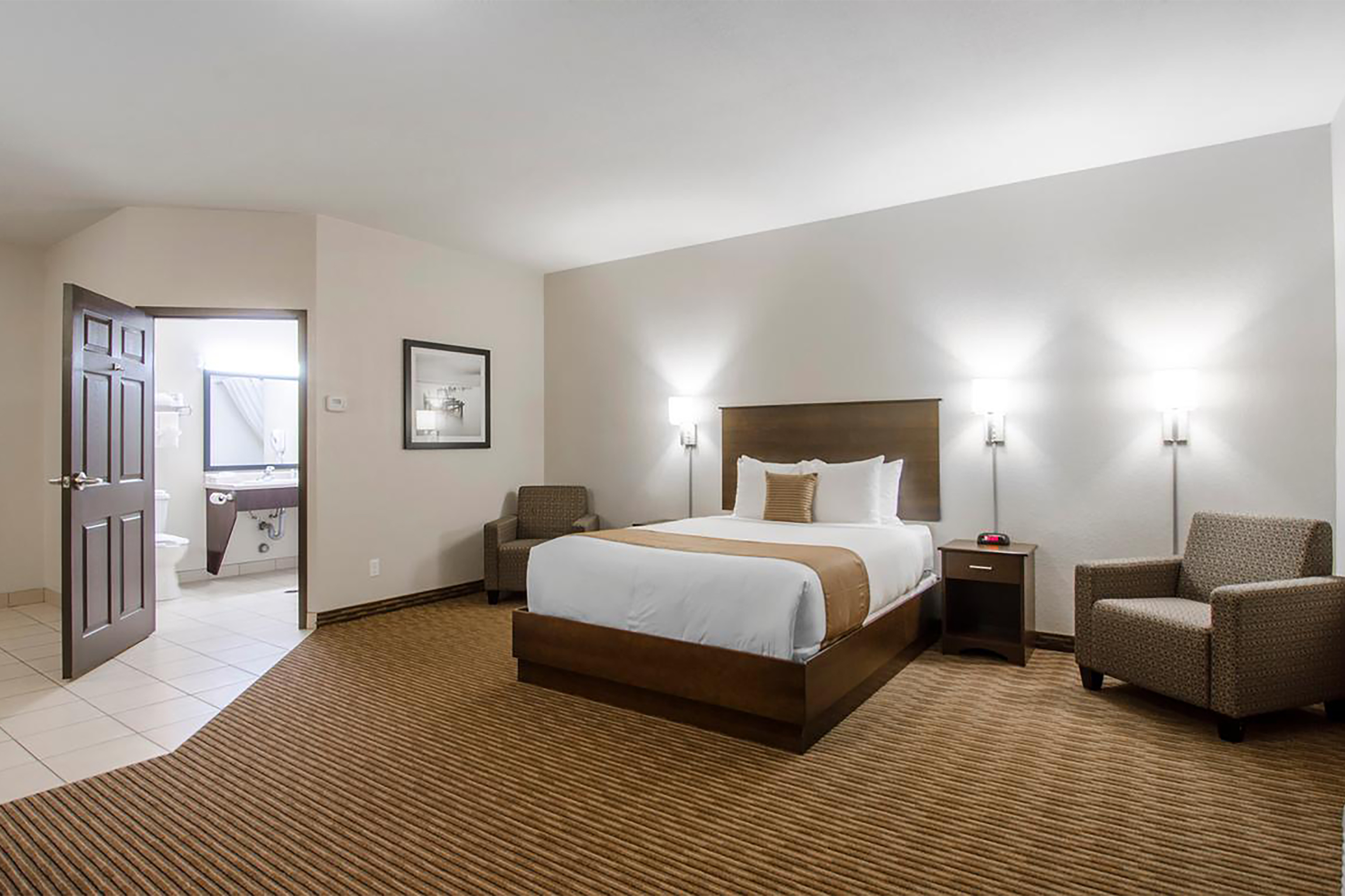 Guest room at the Travelodge Suites by Wyndham Estevan in Estevan, Saskatchewan