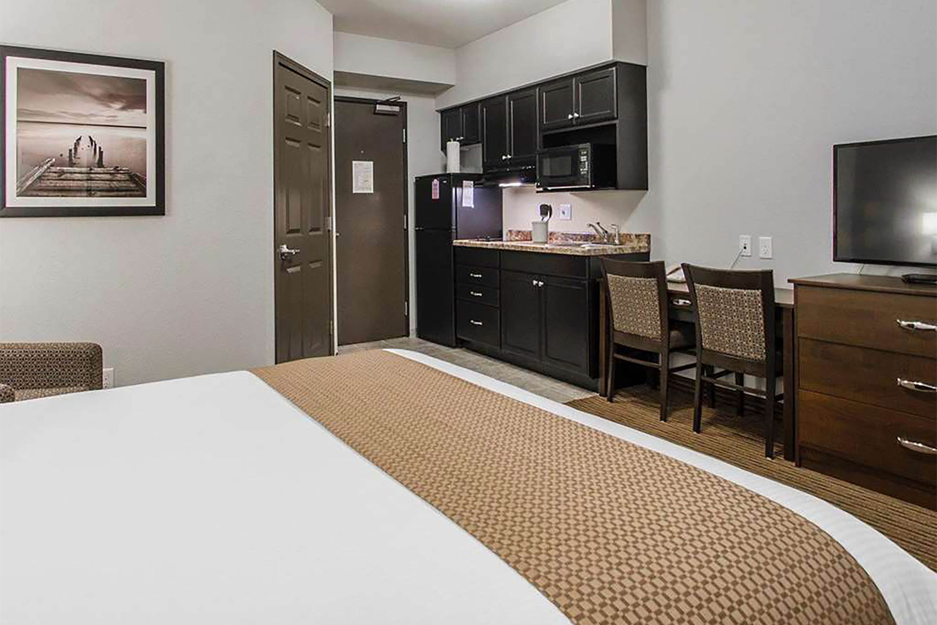Guest room at the Travelodge Suites by Wyndham Estevan in Estevan, Saskatchewan