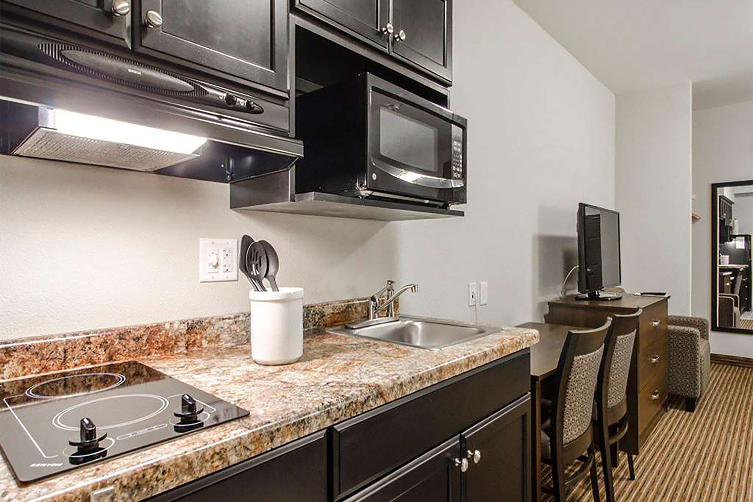 Guest room at the Travelodge Suites by Wyndham Estevan in Estevan, Saskatchewan