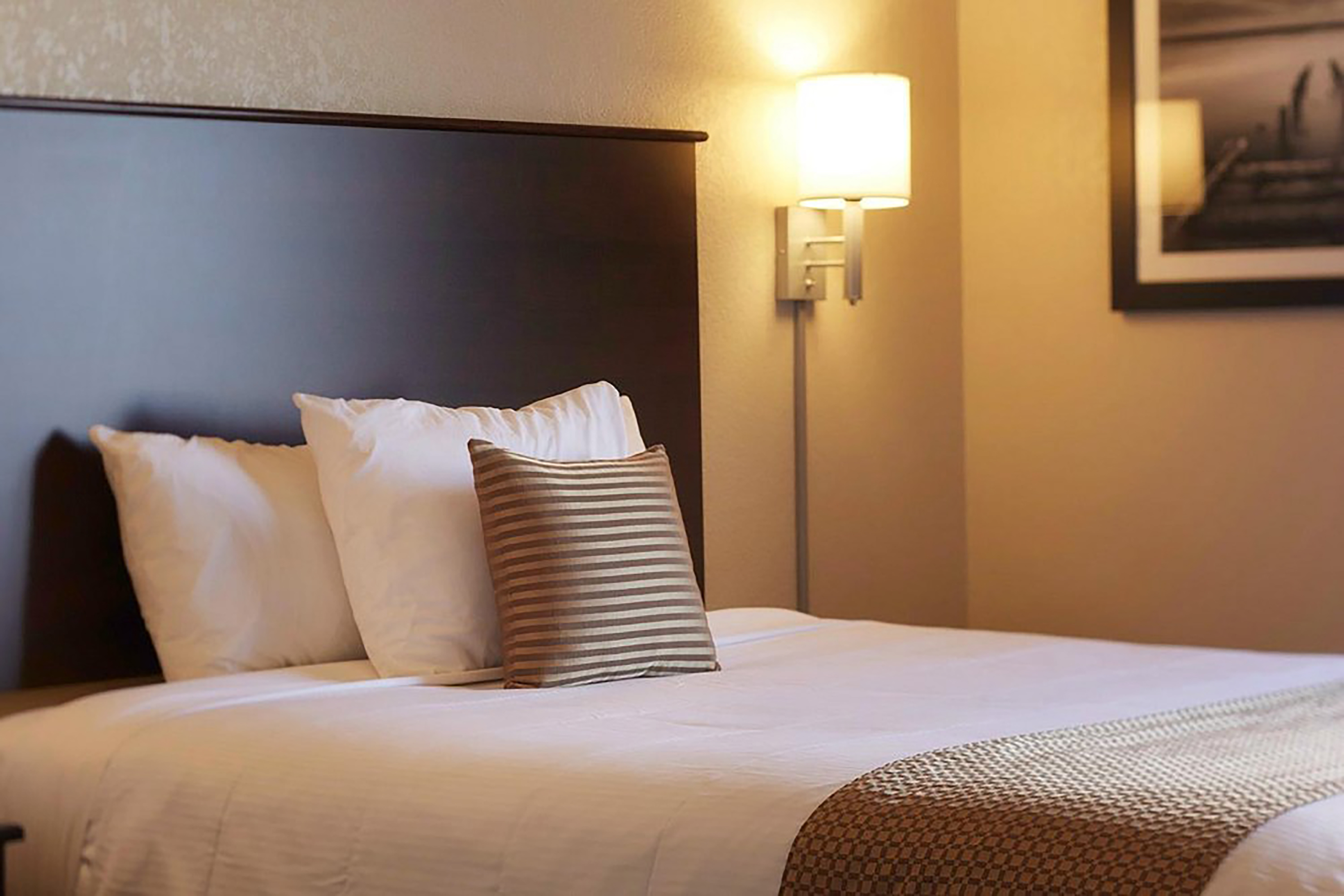 Guest room at the Travelodge Suites by Wyndham Estevan in Estevan, Saskatchewan