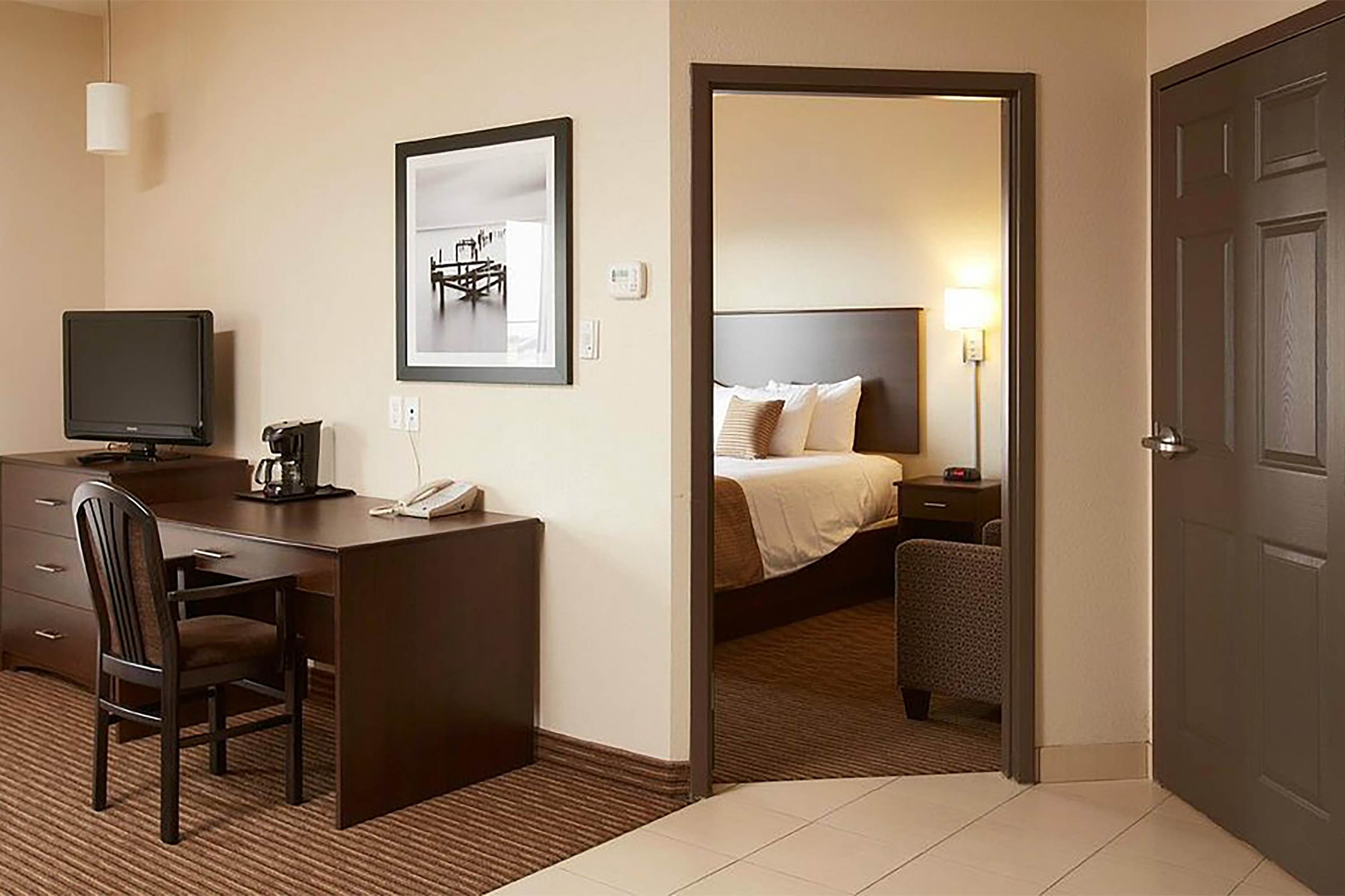 Guest room at the Travelodge Suites by Wyndham Estevan in Estevan, Saskatchewan