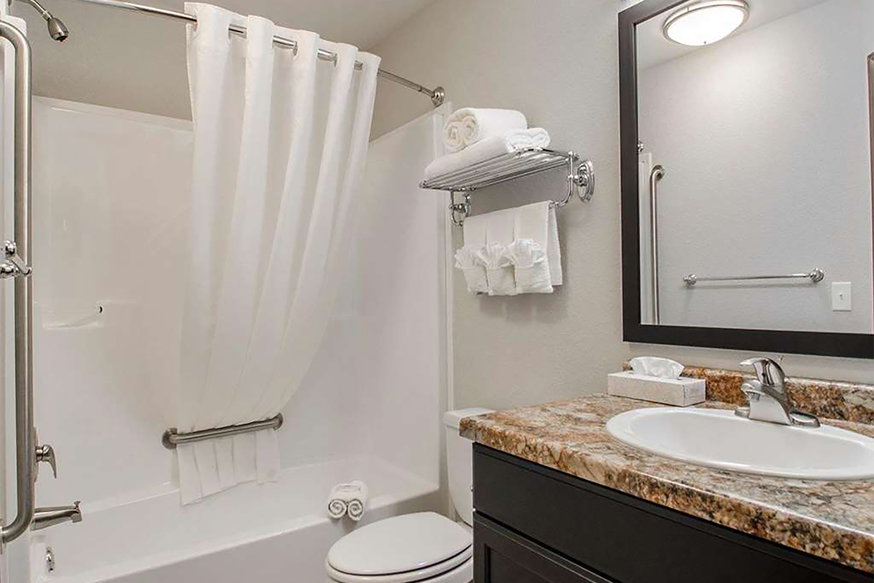 Guest room bath at the Travelodge Suites by Wyndham Estevan in Estevan, Saskatchewan
