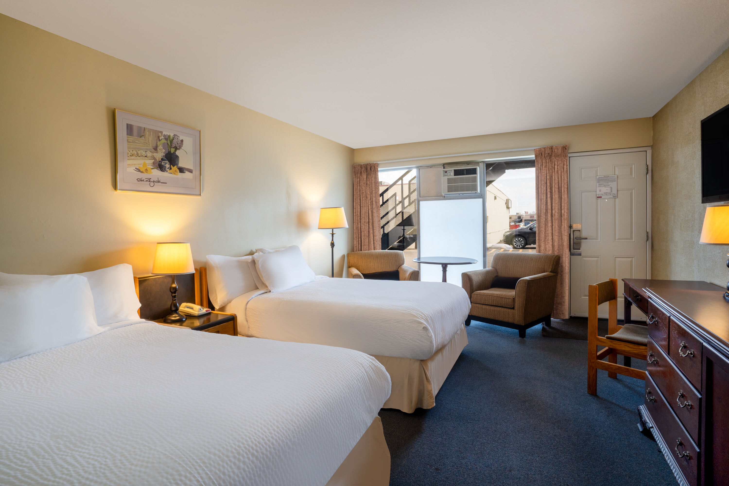 Guest room at the Thriftlodge by Wyndham Regina North in Regina, Saskatchewan