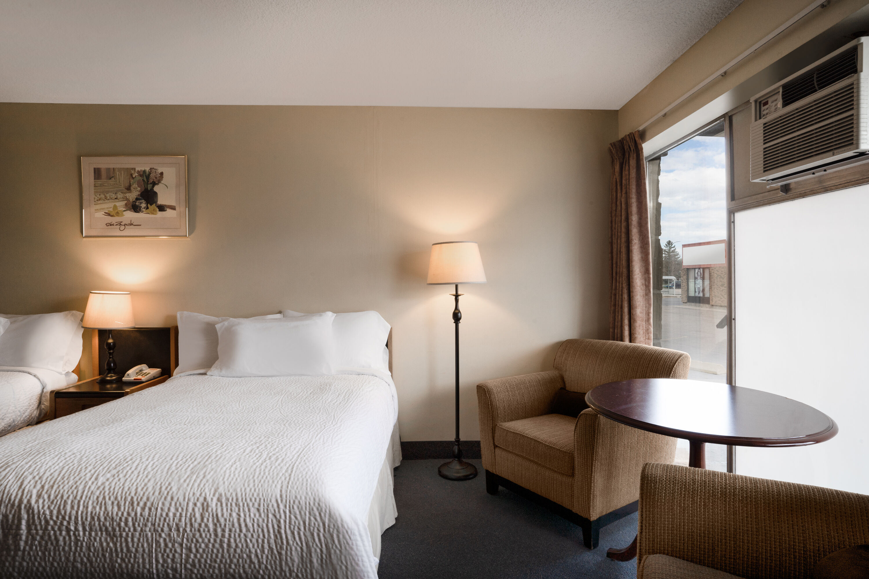 Guest room at the Thriftlodge by Wyndham Regina North in Regina, Saskatchewan
