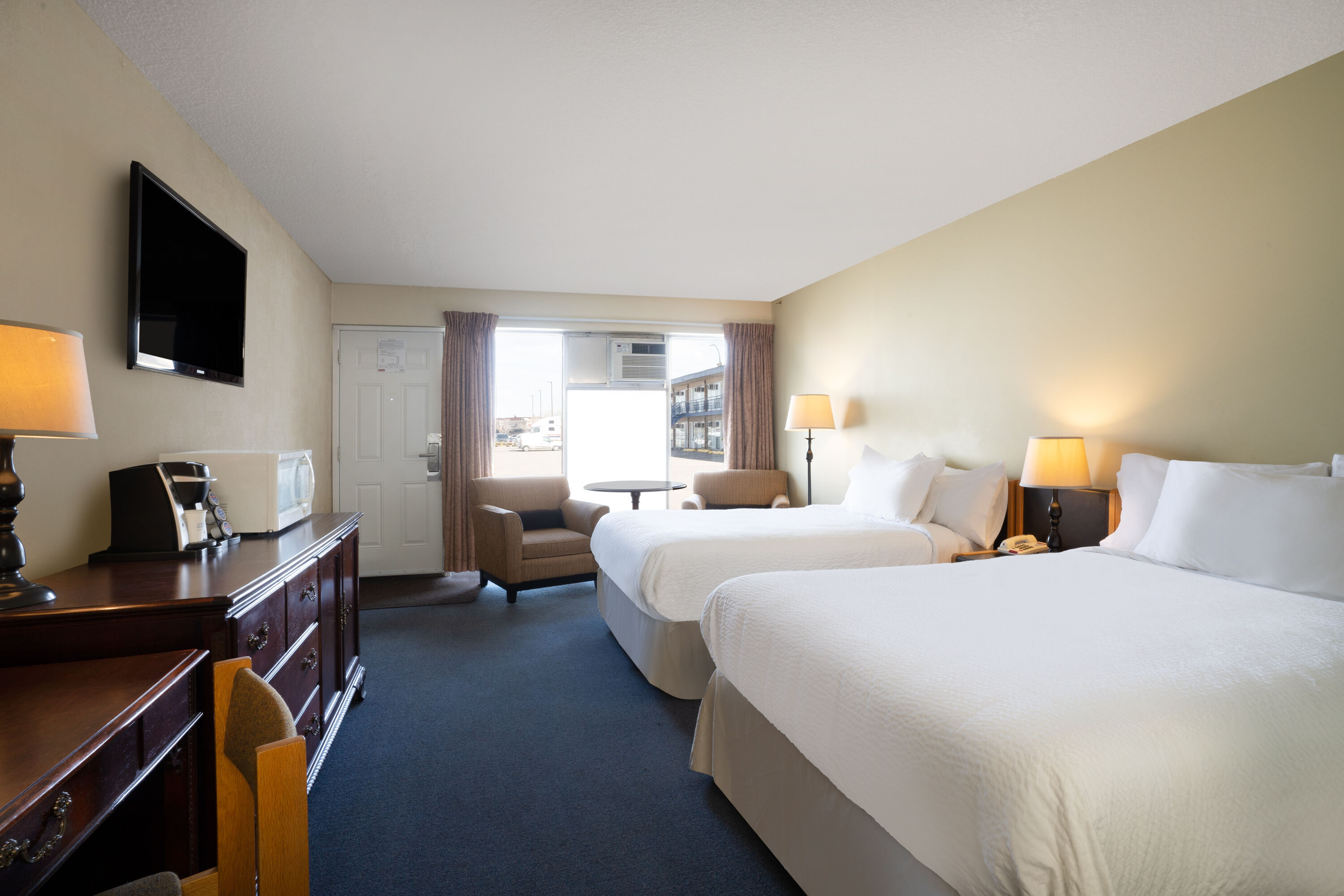 Guest room at the Thriftlodge by Wyndham Regina North in Regina, Saskatchewan