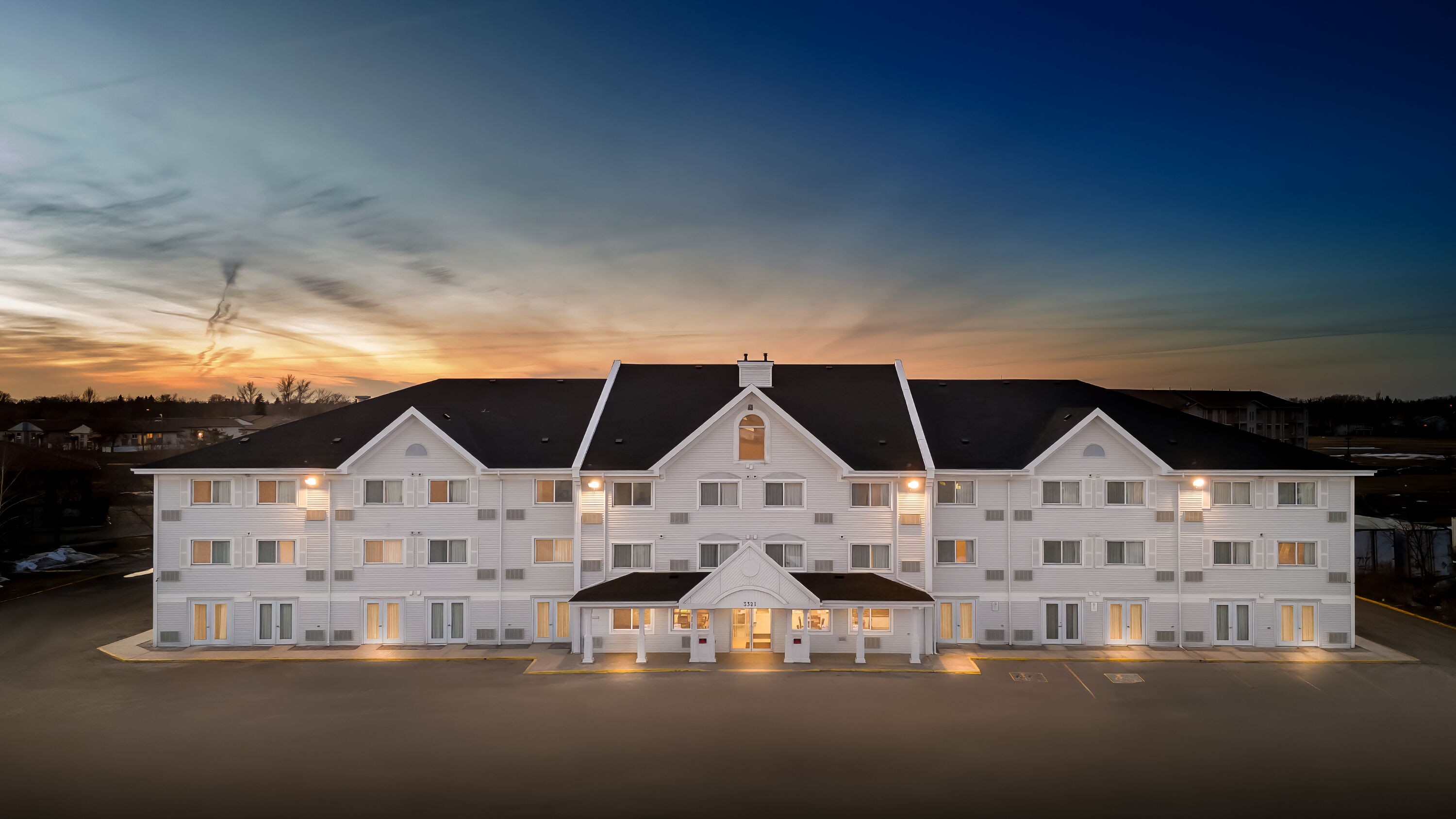 Exterior Night Image of Travelodge Suites by Wyndham Regina / Eastgate Bay hotel in Regina, Saskatchewan