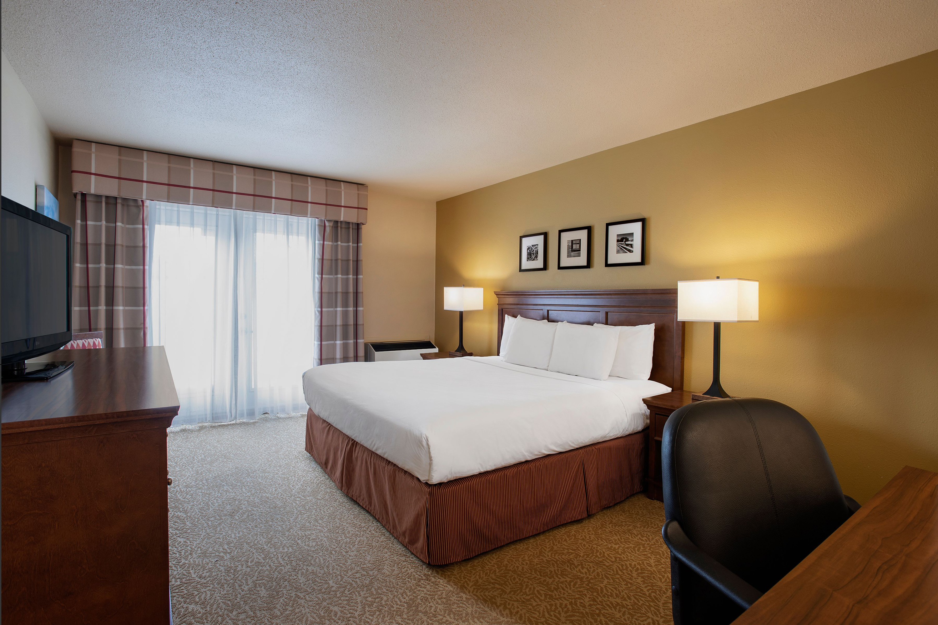 Guest room at the Travelodge Suites by Wyndham Regina / Eastgate Bay in Regina, Saskatchewan