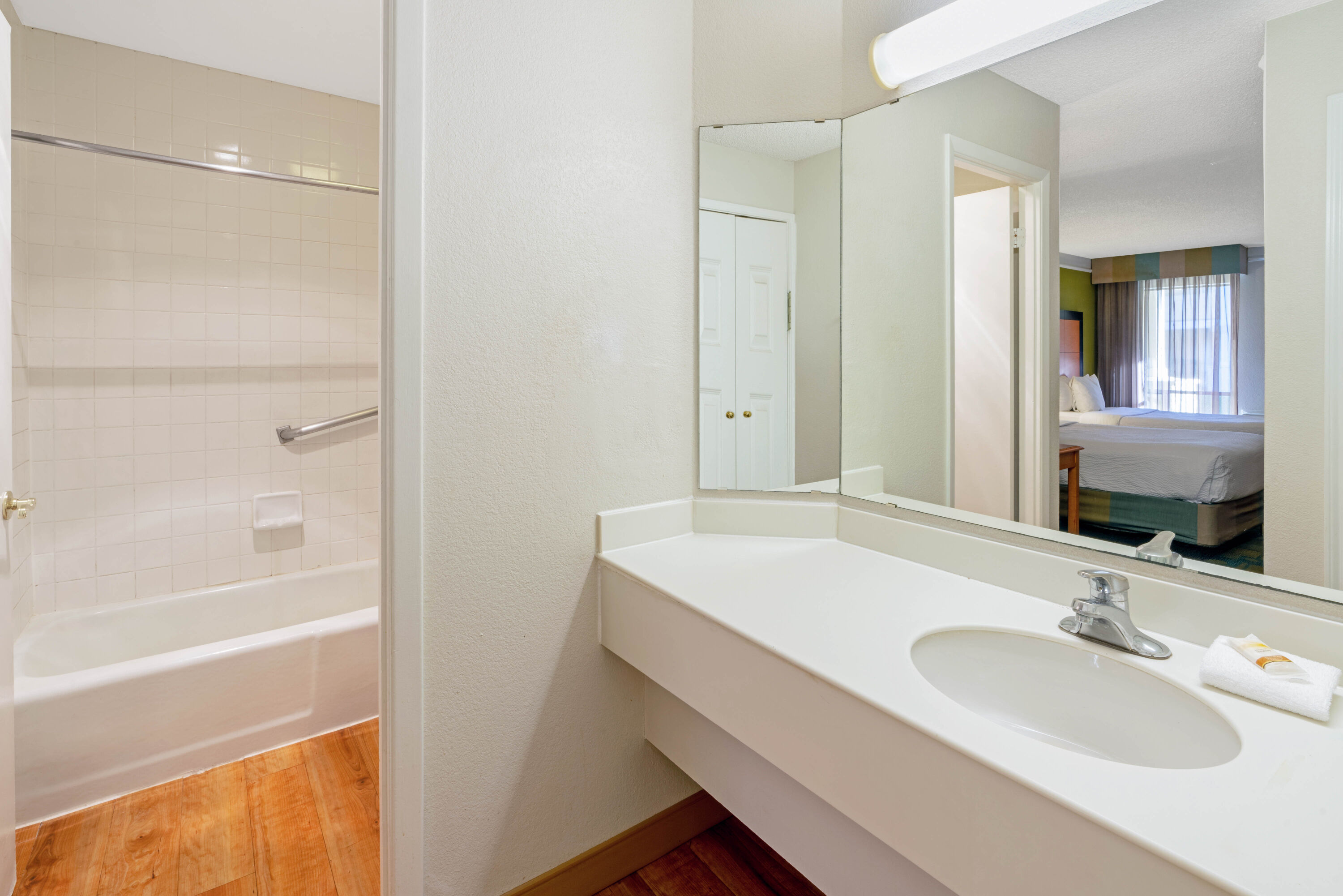 Guest room bath at the Travelodge by Wyndham Phoenix North in Phoenix, Arizona