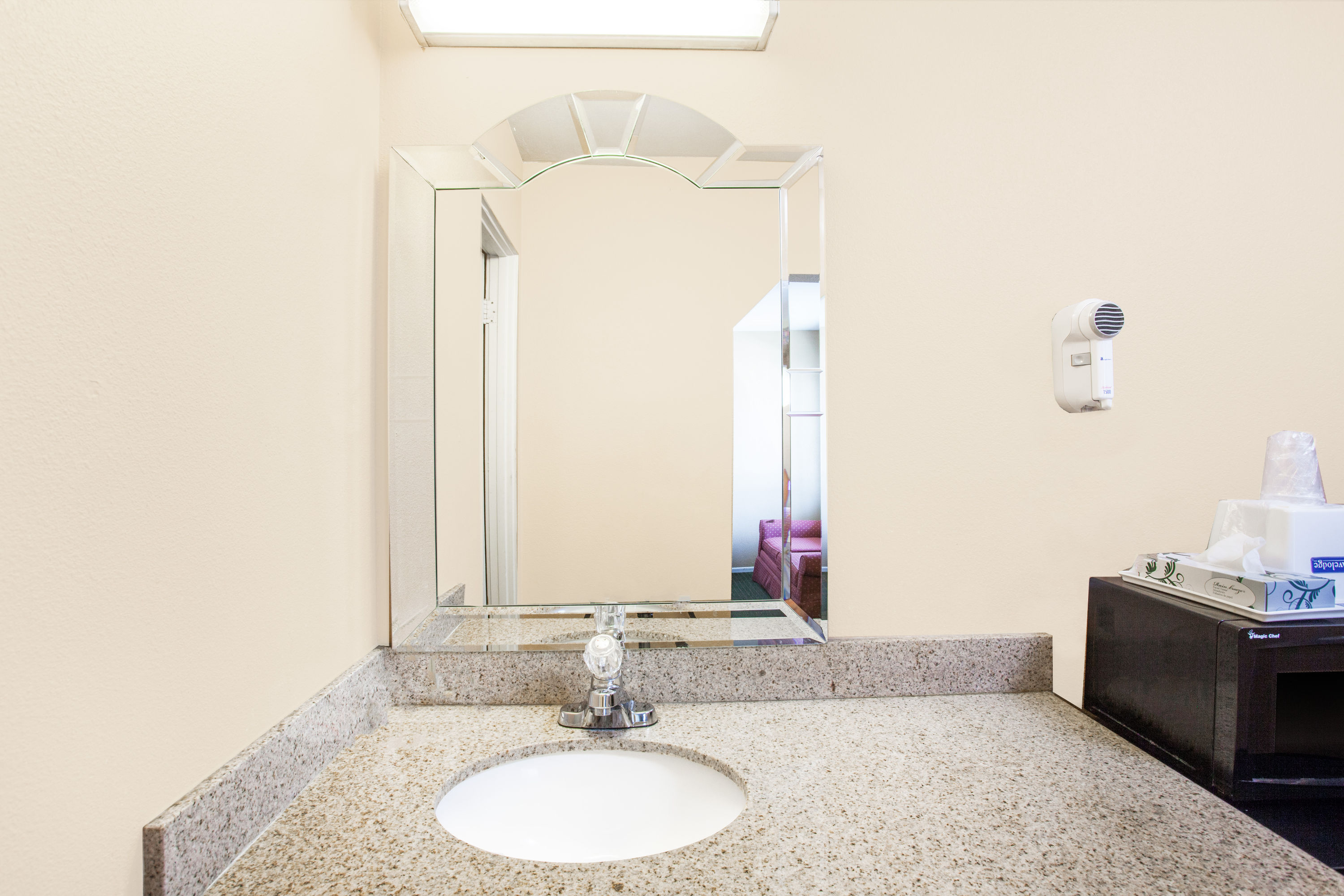 Guest room bath at the Travelodge by Wyndham Barstow in Barstow, California