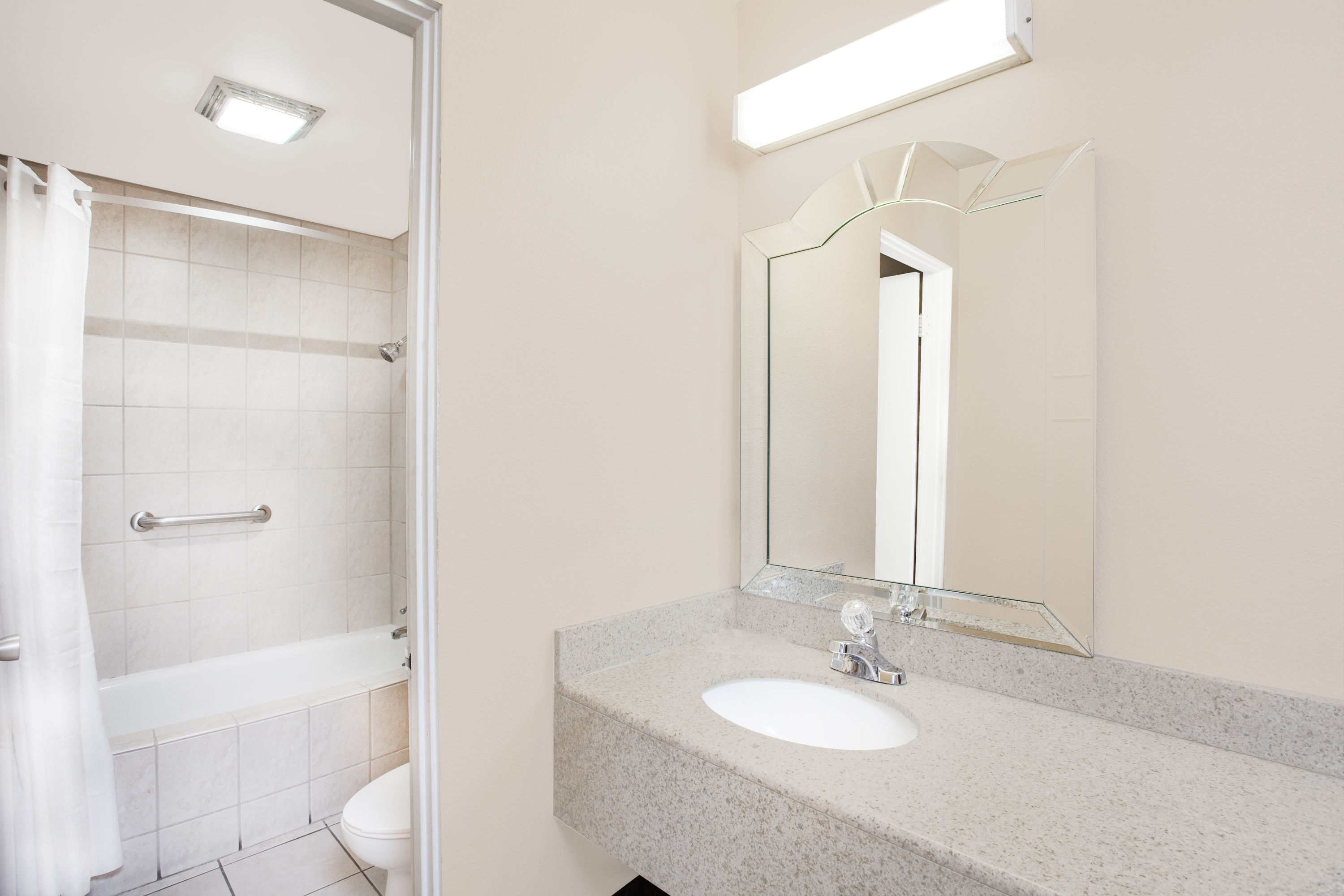 Guest room bath at the Travelodge by Wyndham Barstow in Barstow, California