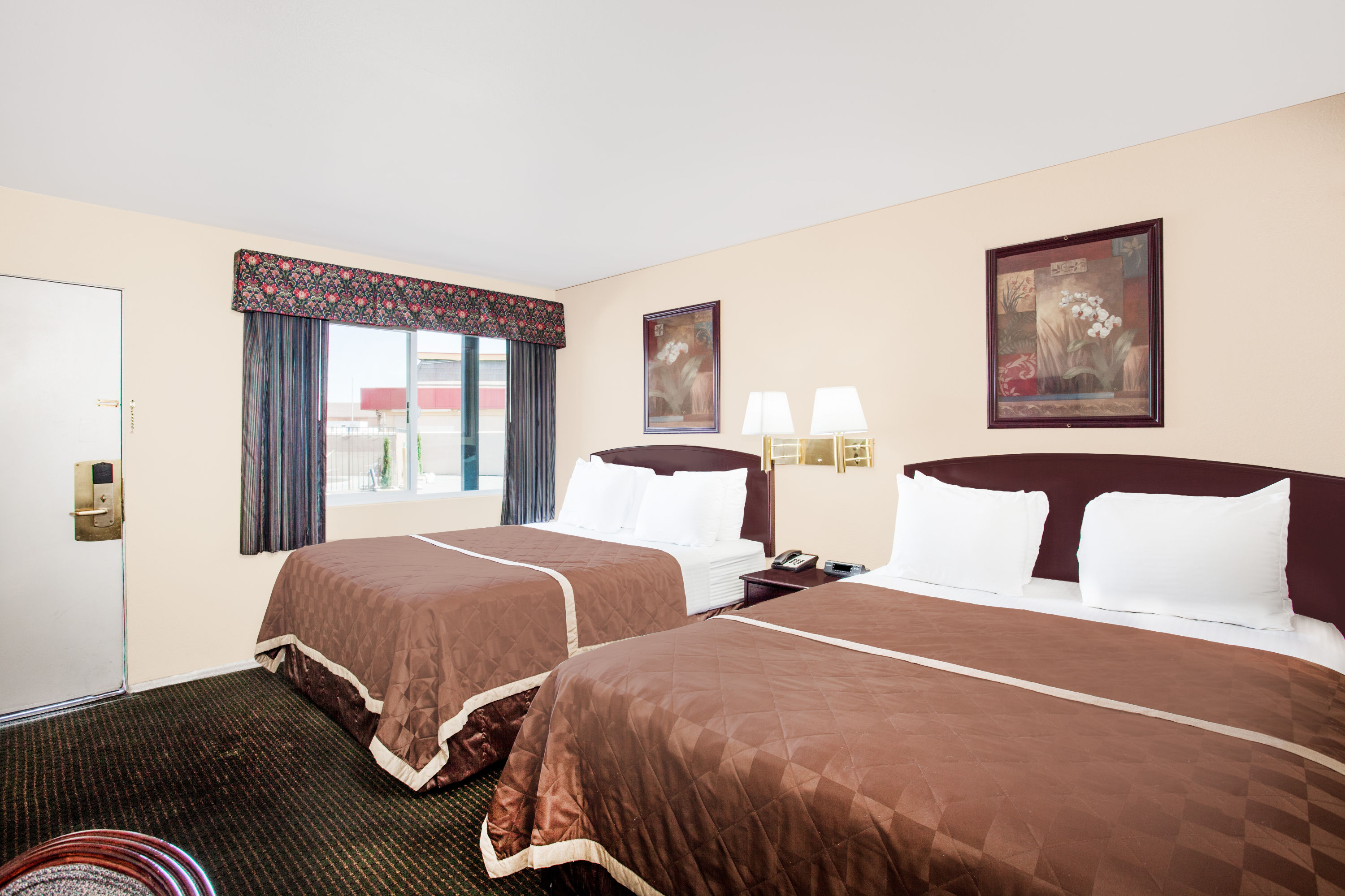 Guest room at the Travelodge by Wyndham Barstow in Barstow, California