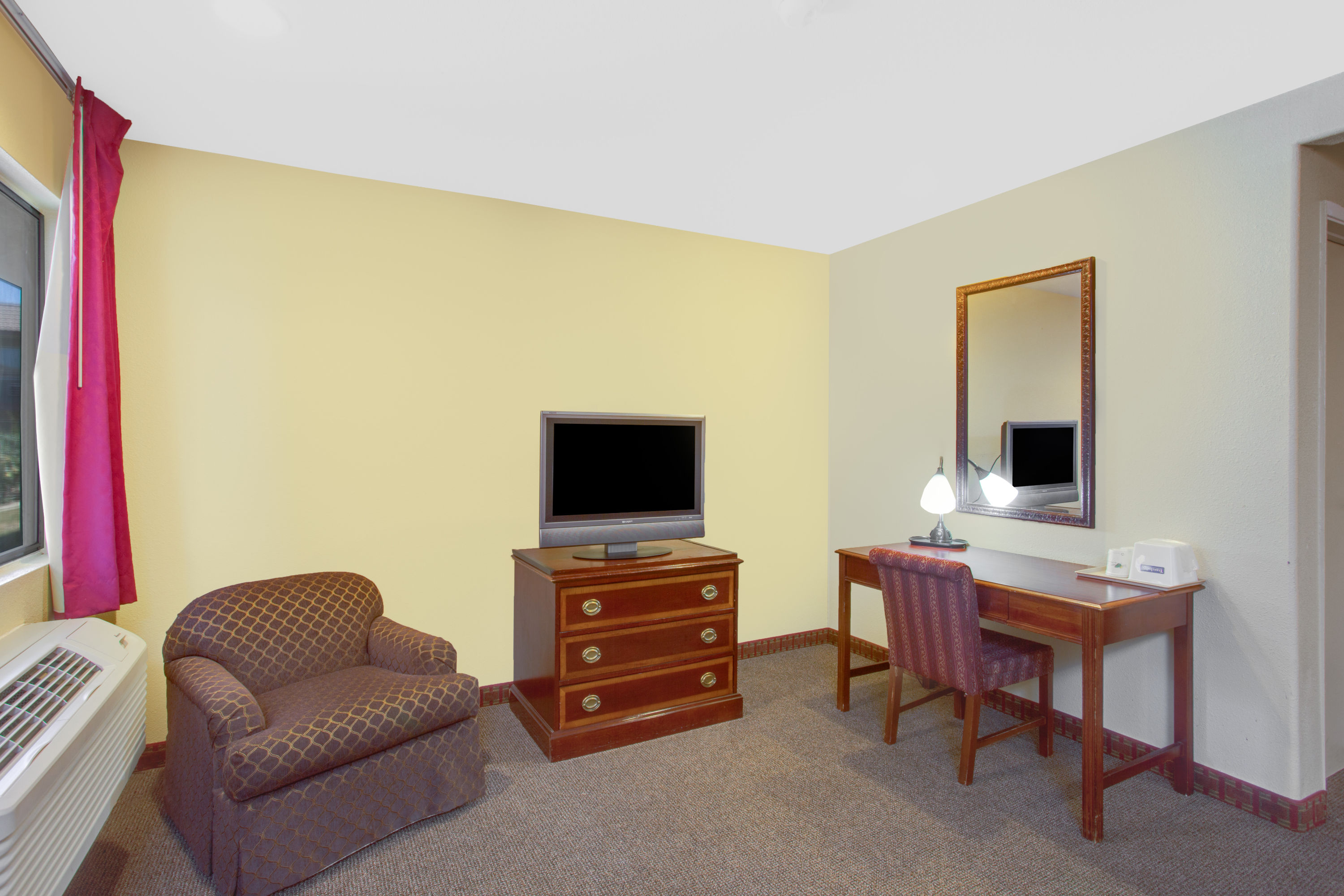 Guest room at the Travelodge by Wyndham Coalinga in Coalinga, California