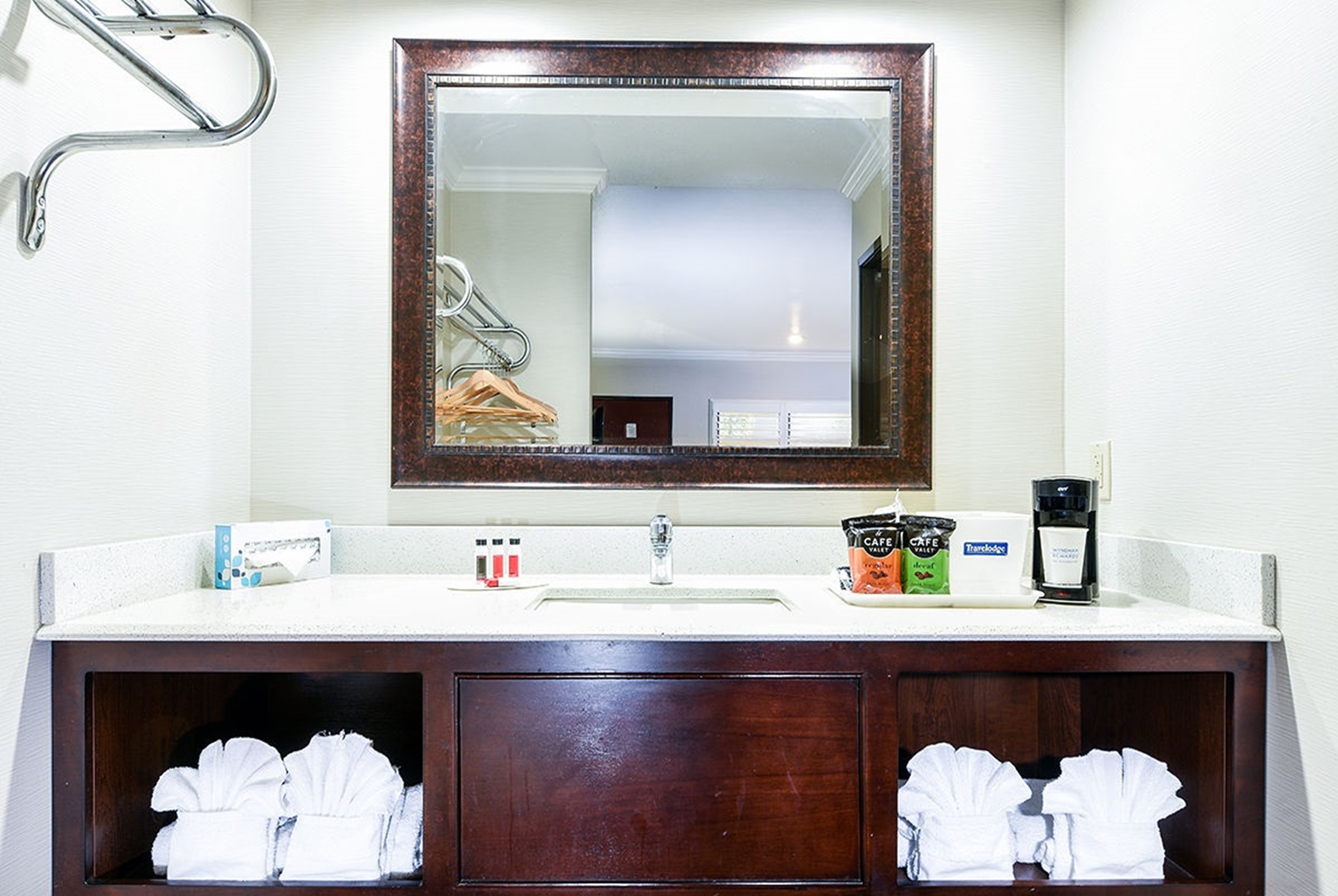 Guest room bath at the Travelodge by Wyndham Commerce Los Angeles Area in Commerce, California