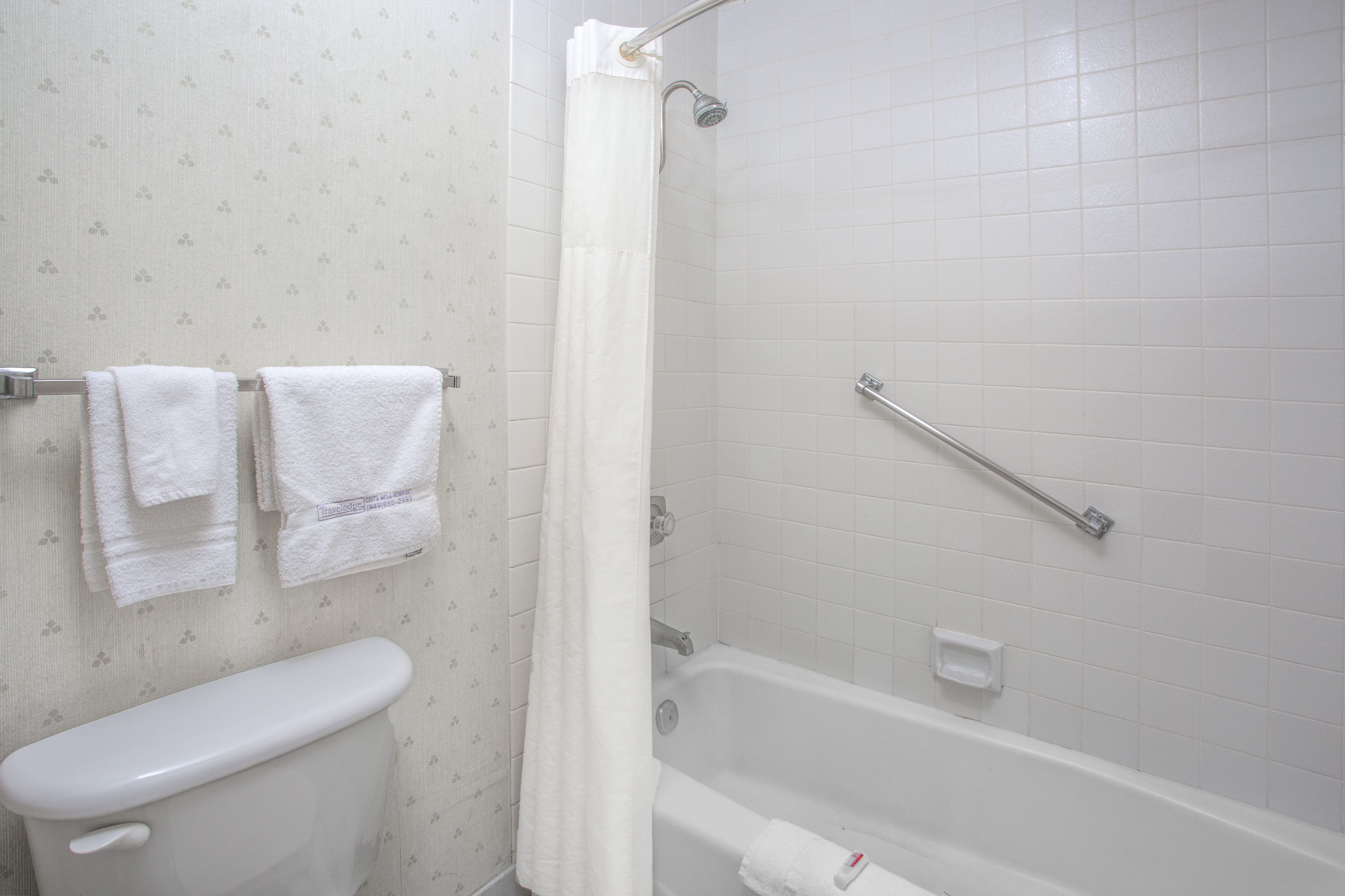 Guest room bath at the Travelodge by Wyndham Costa Mesa Newport Beach Hacienda in Costa Mesa, California