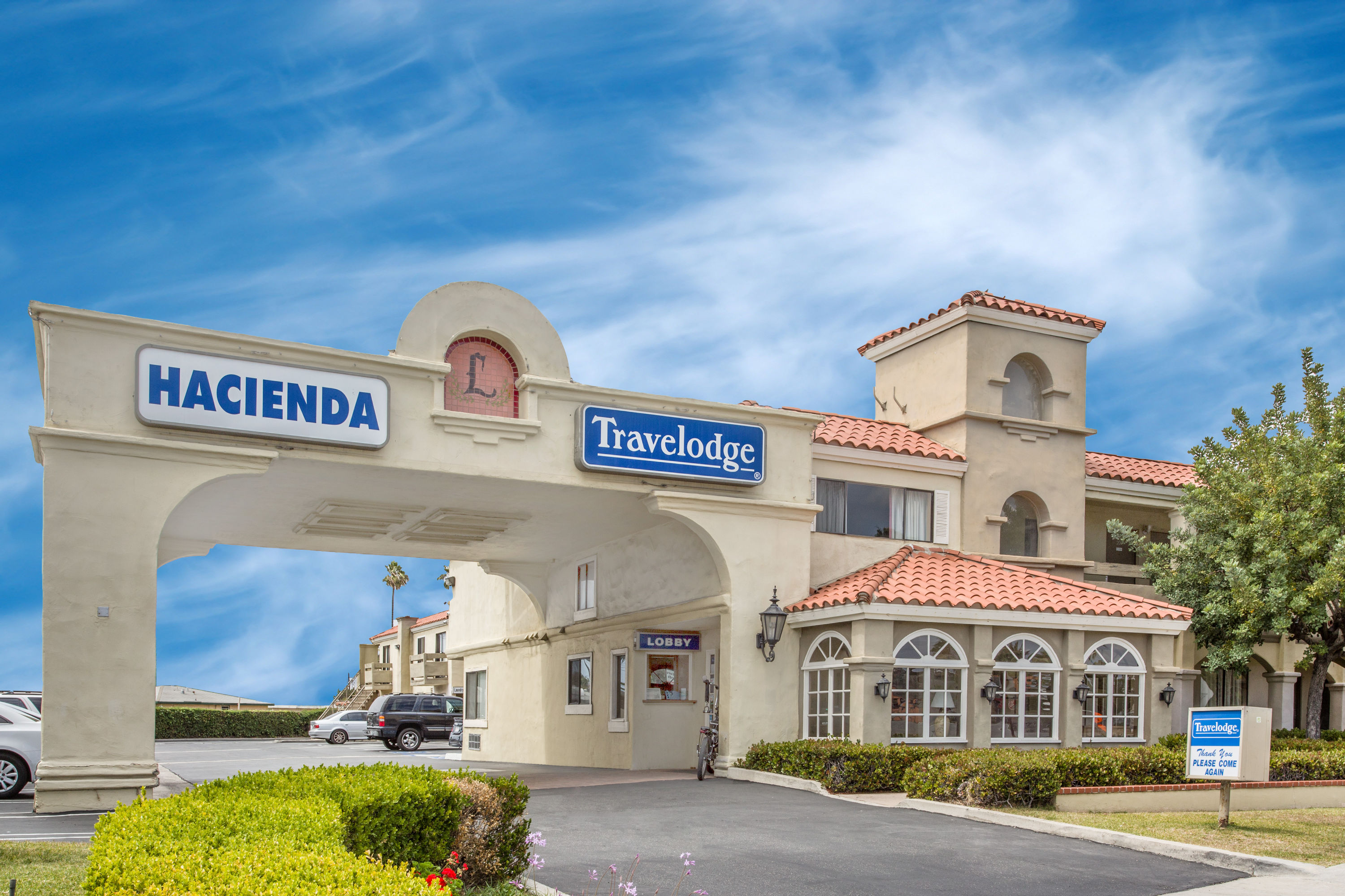 Exterior Day Image of Travelodge by Wyndham Costa Mesa Newport Beach Hacienda hotel in Costa Mesa, California