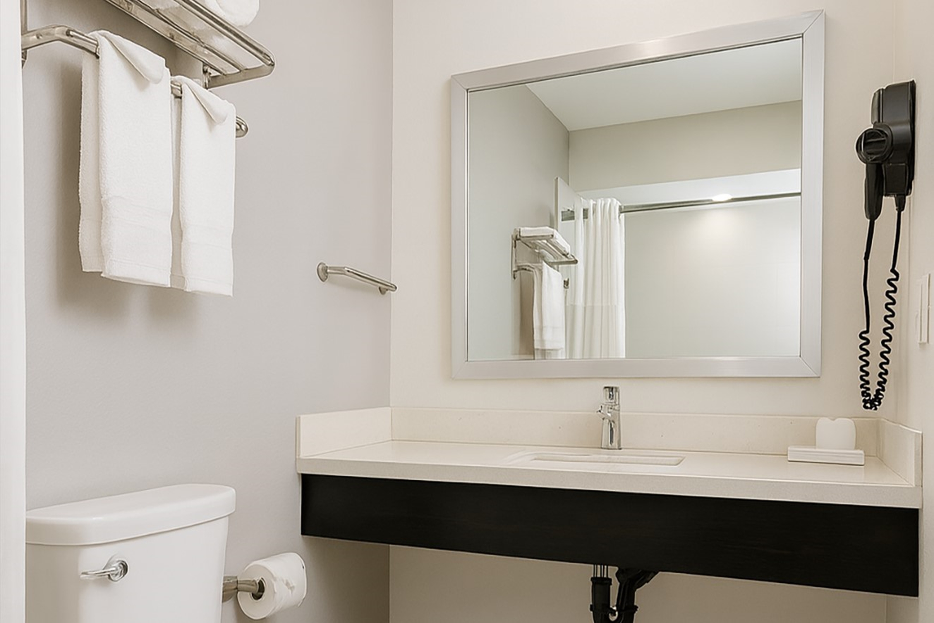 Guest room bath at the Travelodge by Wyndham LAX in El Segundo, California