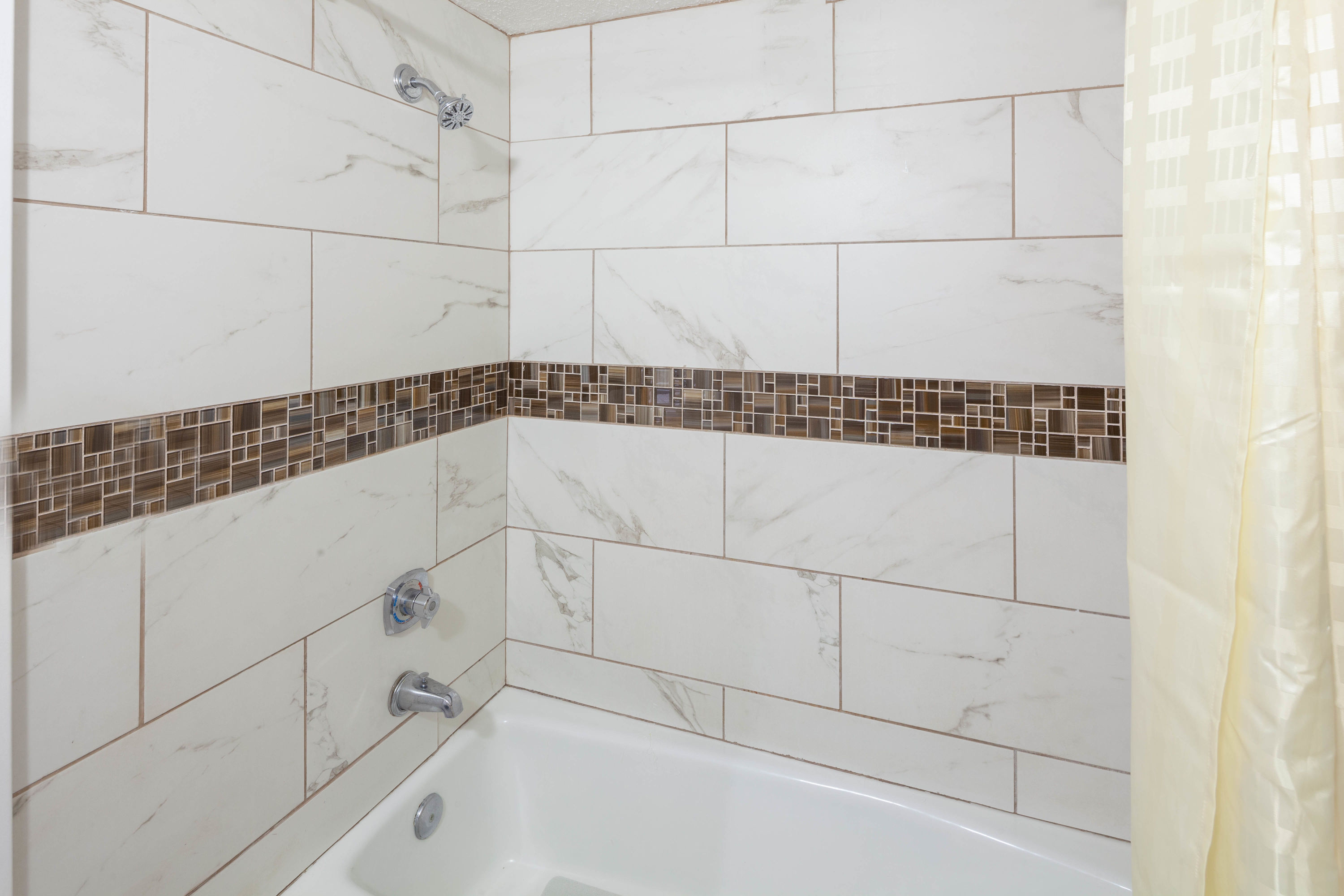 Guest room bath at the Travelodge by Wyndham Harbor City in Harbor City, California