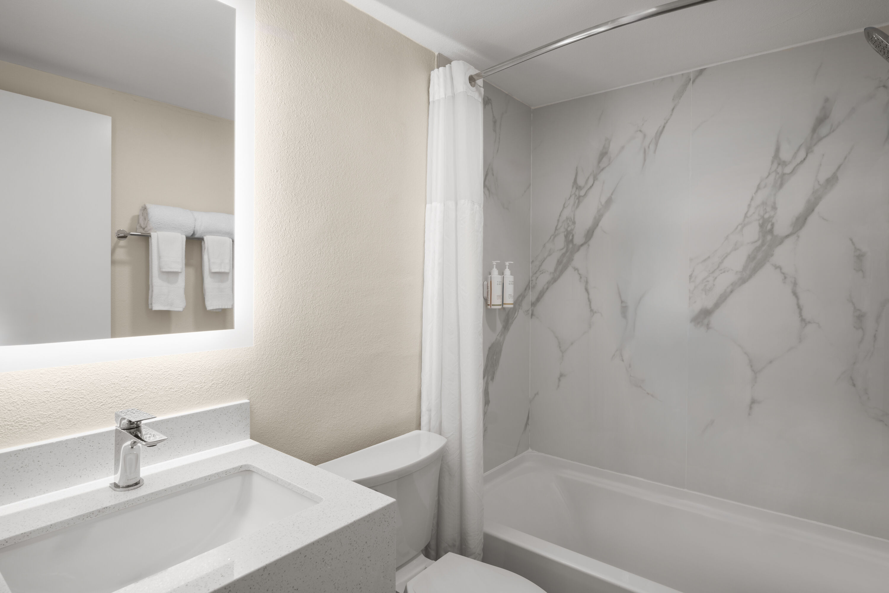 Guest room bath at the Travelodge by Wyndham Imperial/El Centro in Imperial, California