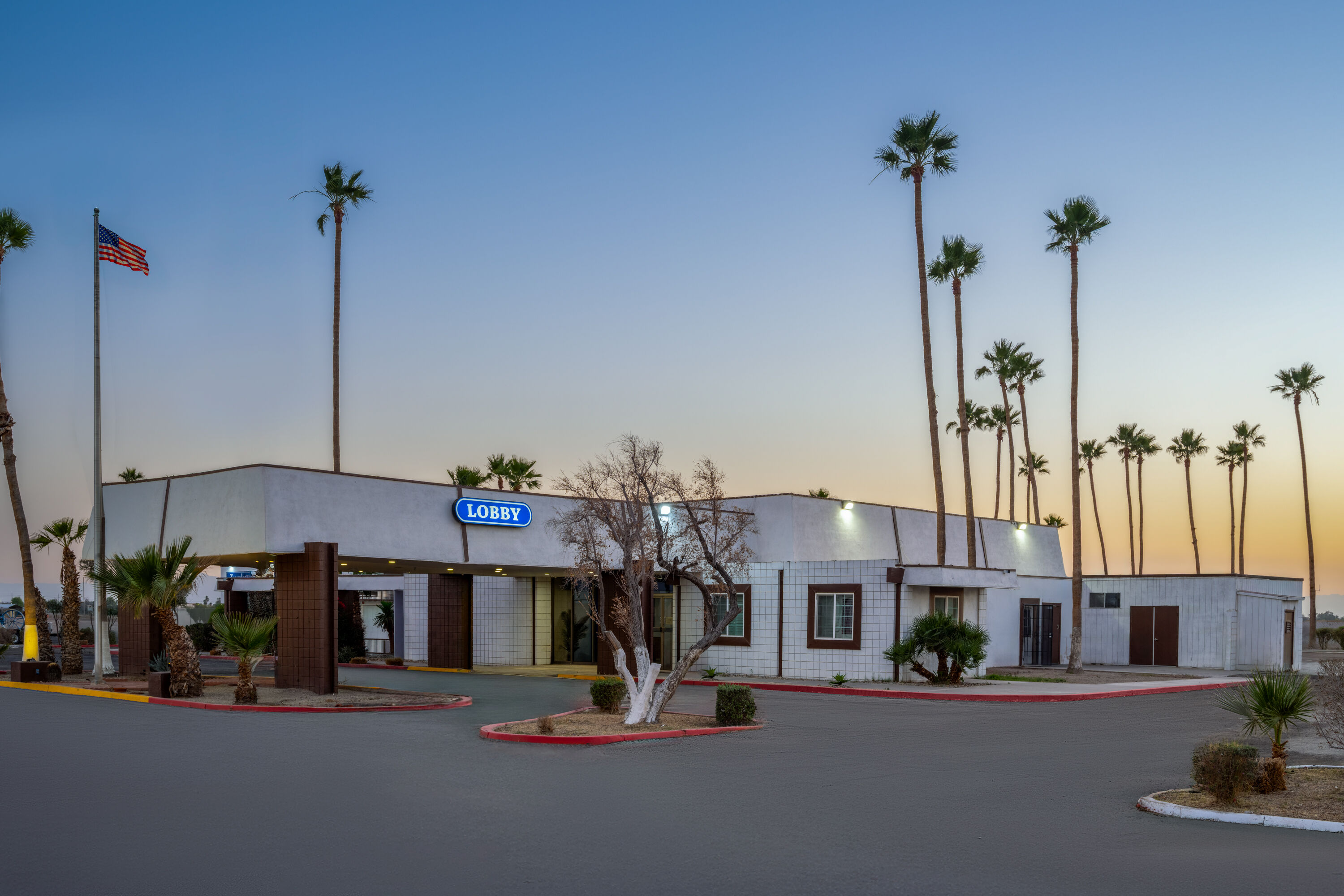 Exterior Dusk Image of Travelodge by Wyndham Imperial/El Centro hotel in Imperial, California