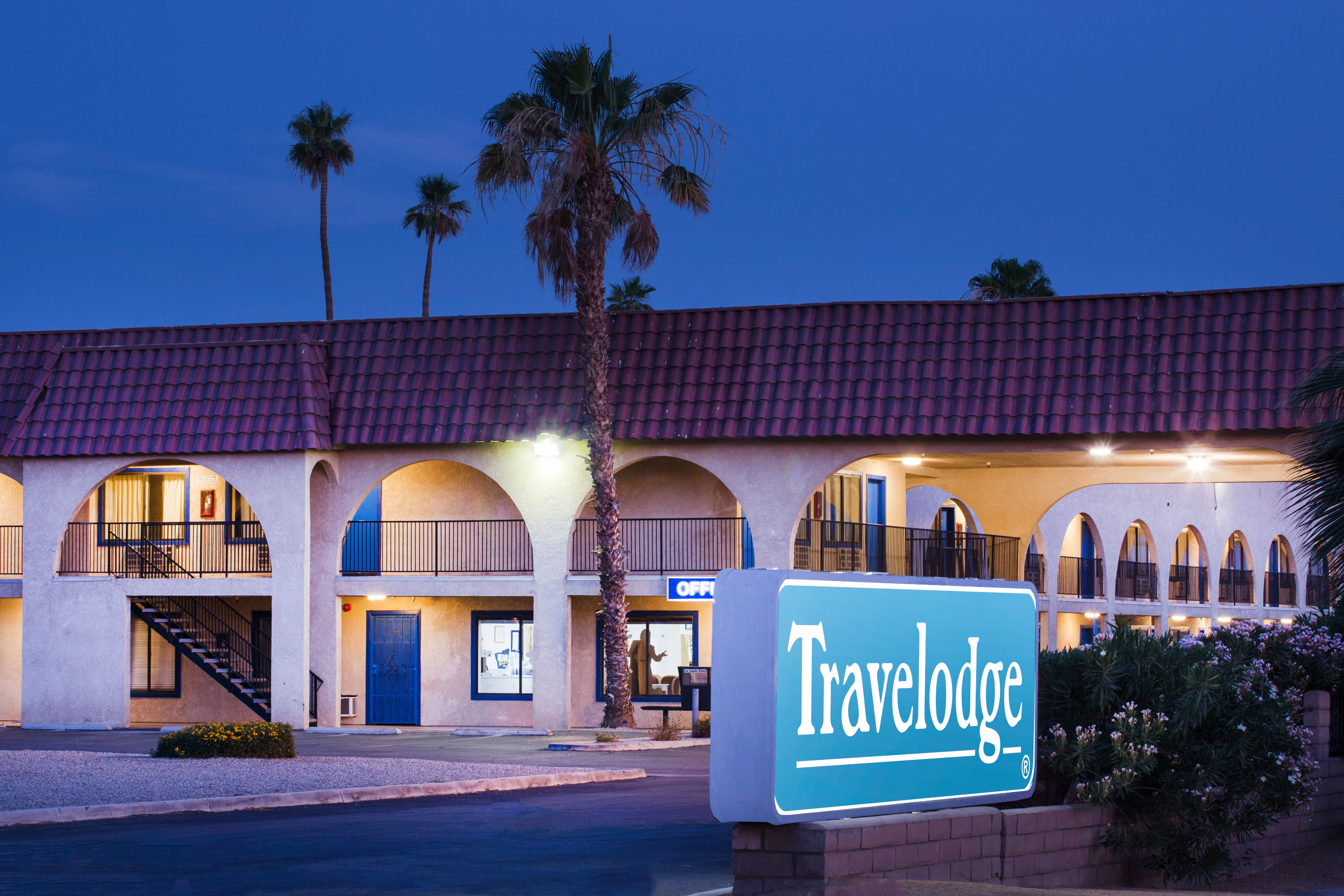 Exterior Dusk Image of Travelodge by Wyndham Indio hotel in Indio, California