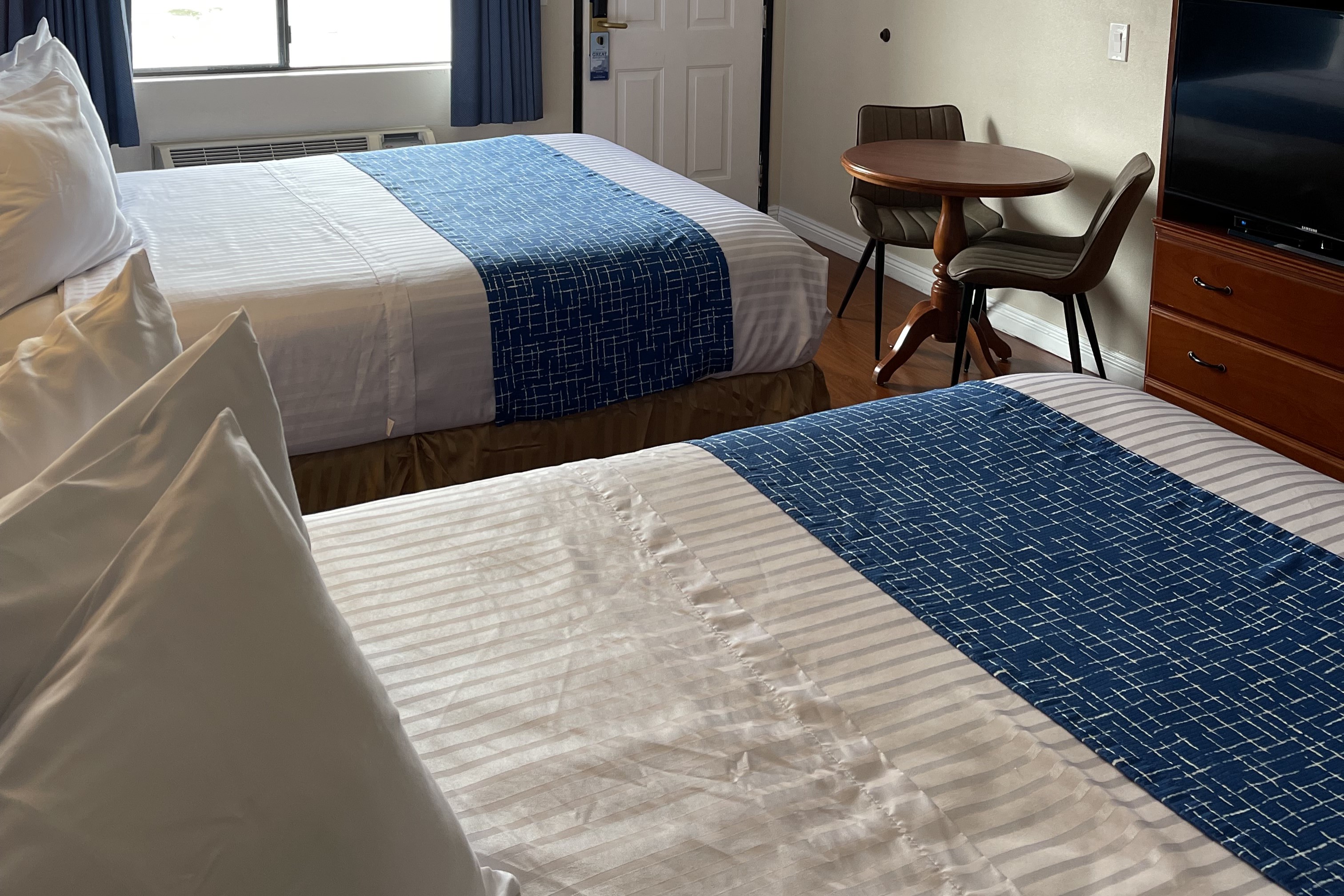 Guest room at the Travelodge by Wyndham Lynwood in Lynwood, California