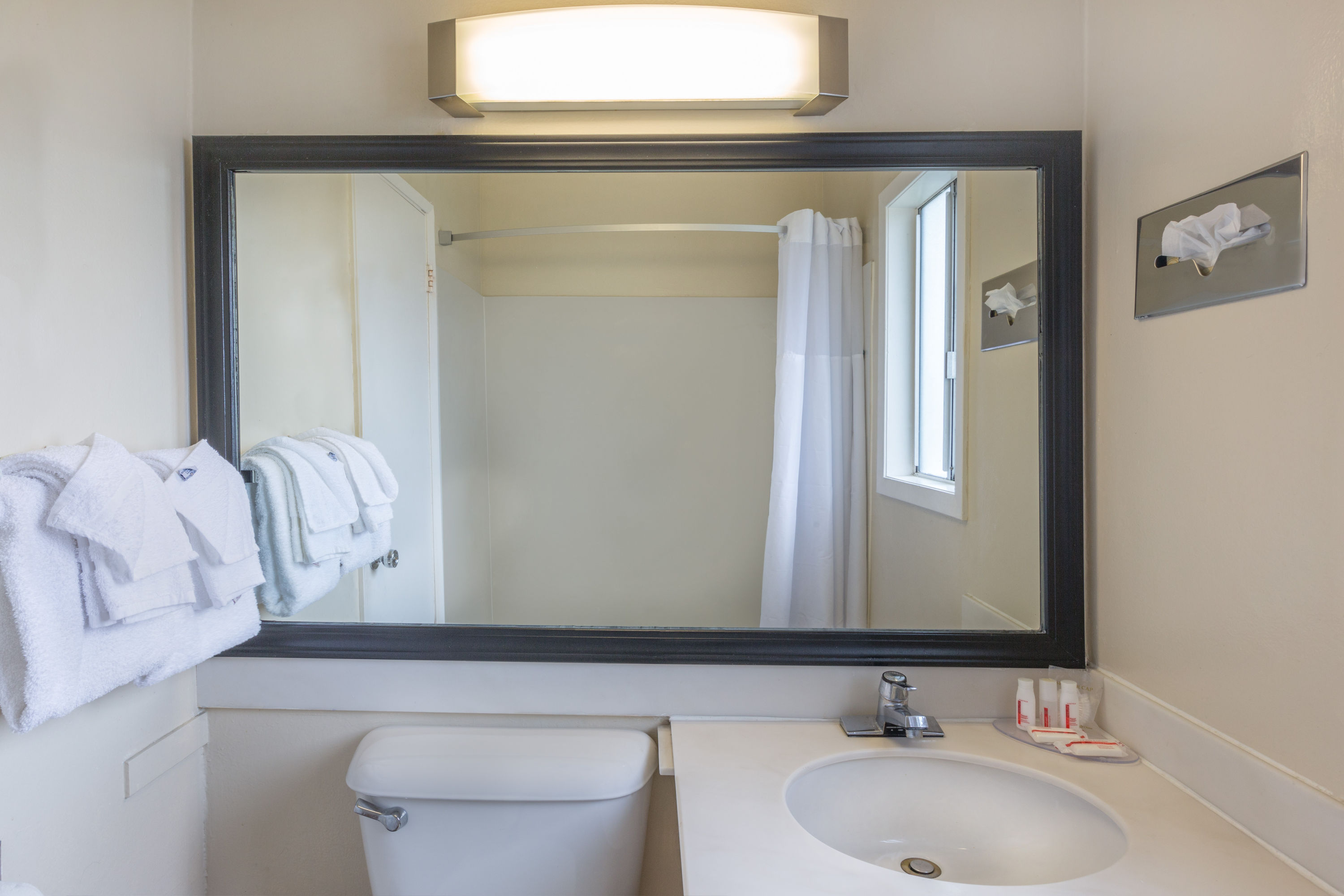 Guest room bath at the Travelodge by Wyndham Santa Rosa Wine Country in Santa Rosa, California