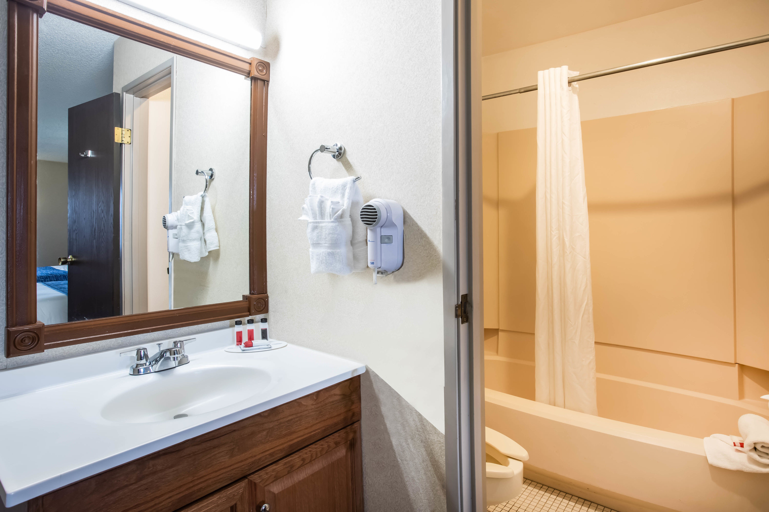 Guest room bath at the Travelodge by Wyndham Colorado Springs Airport/Peterson SFB in Colorado Springs, Colorado