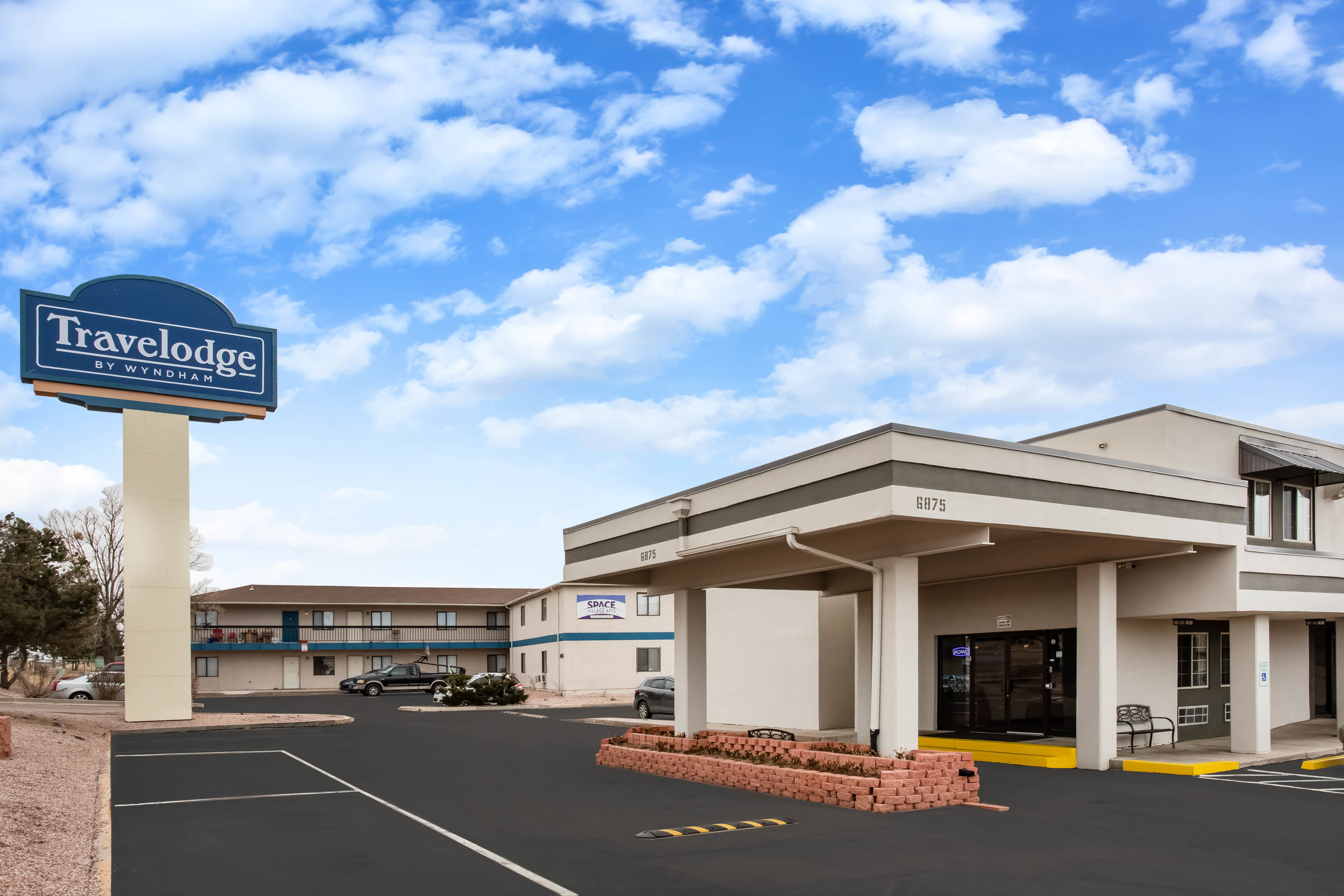 Exterior Day Image of Travelodge by Wyndham Colorado Springs Airport/Peterson SFB hotel in Colorado Springs, Colorado