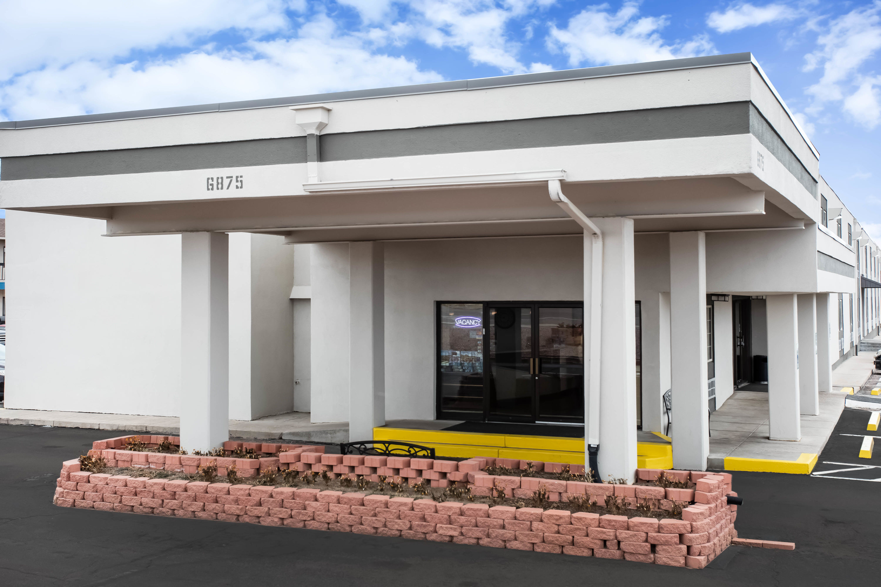 Exterior Day Image of Travelodge by Wyndham Colorado Springs Airport/Peterson SFB hotel in Colorado Springs, Colorado