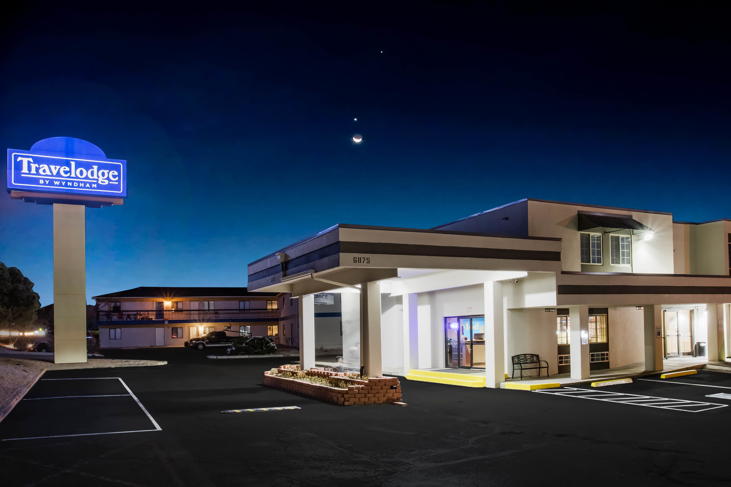Exterior Night Image of Travelodge by Wyndham Colorado Springs Airport/Peterson SFB hotel in Colorado Springs, Colorado