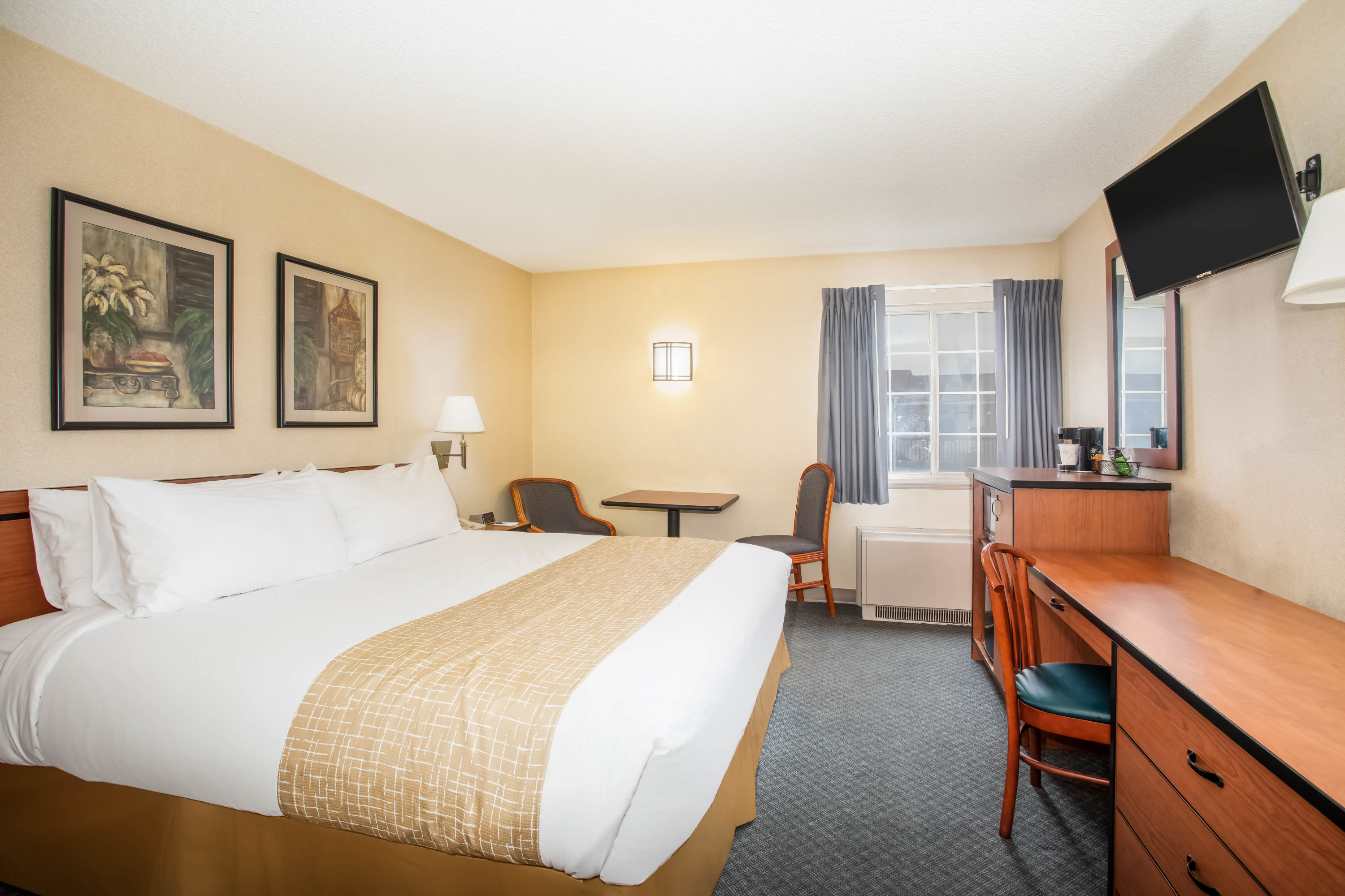 Guest room at the Travelodge by Wyndham Colorado Springs Airport/Peterson SFB in Colorado Springs, Colorado