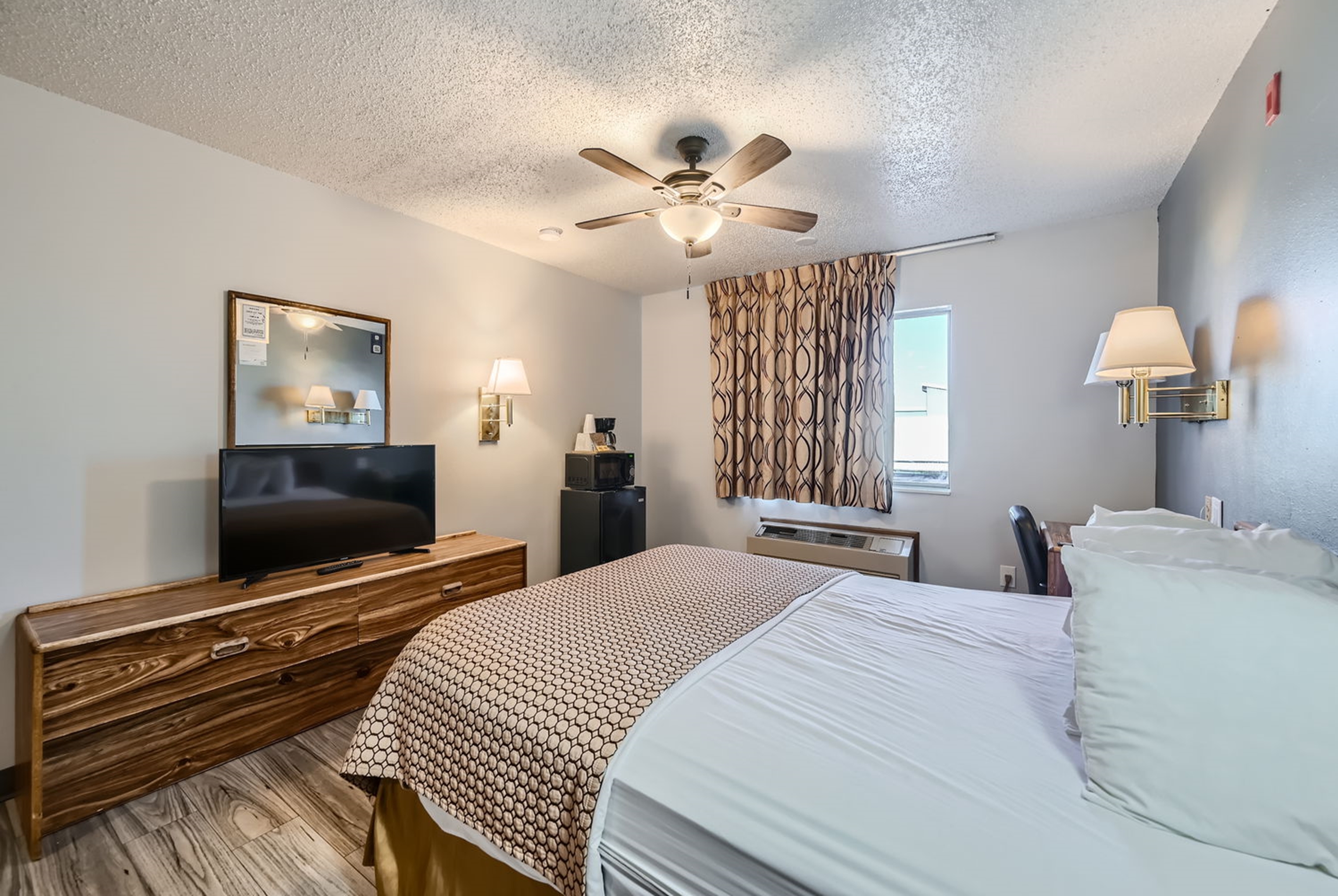 Guest room at the Travelodge by Wyndham Longmont in Longmont, Colorado