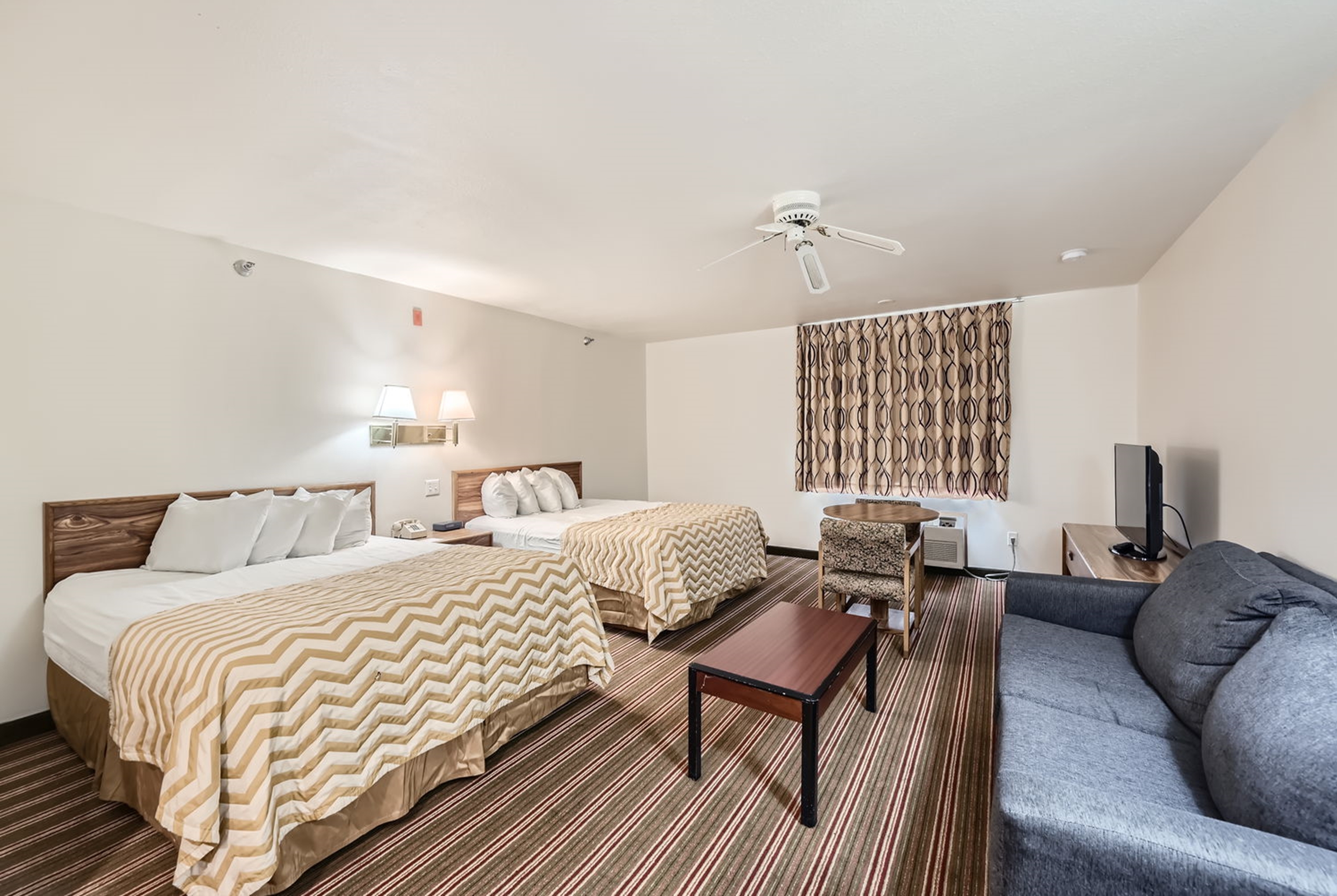 Guest room at the Travelodge by Wyndham Longmont in Longmont, Colorado