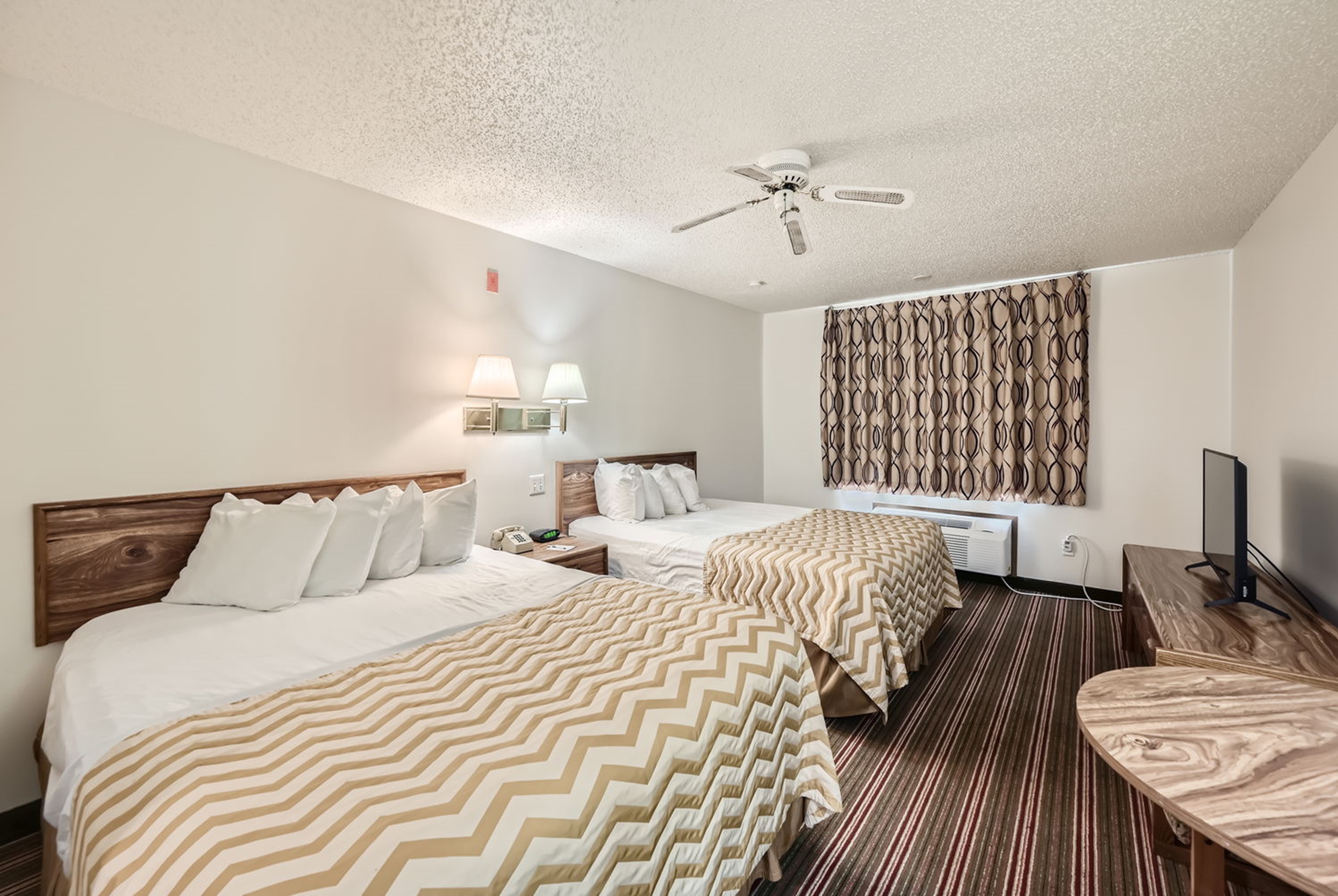 Guest room at the Travelodge by Wyndham Longmont in Longmont, Colorado