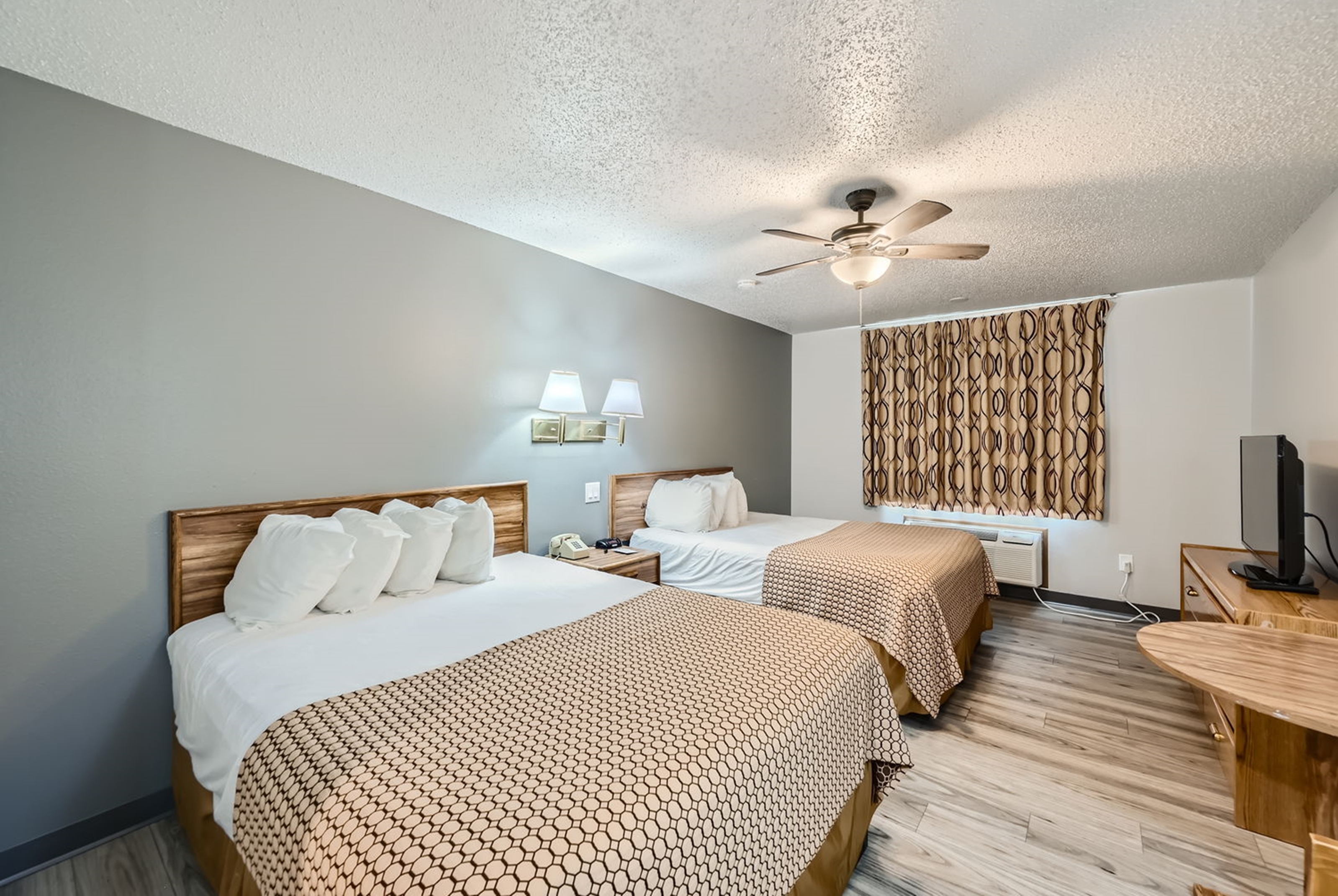 Guest room at the Travelodge by Wyndham Longmont in Longmont, Colorado