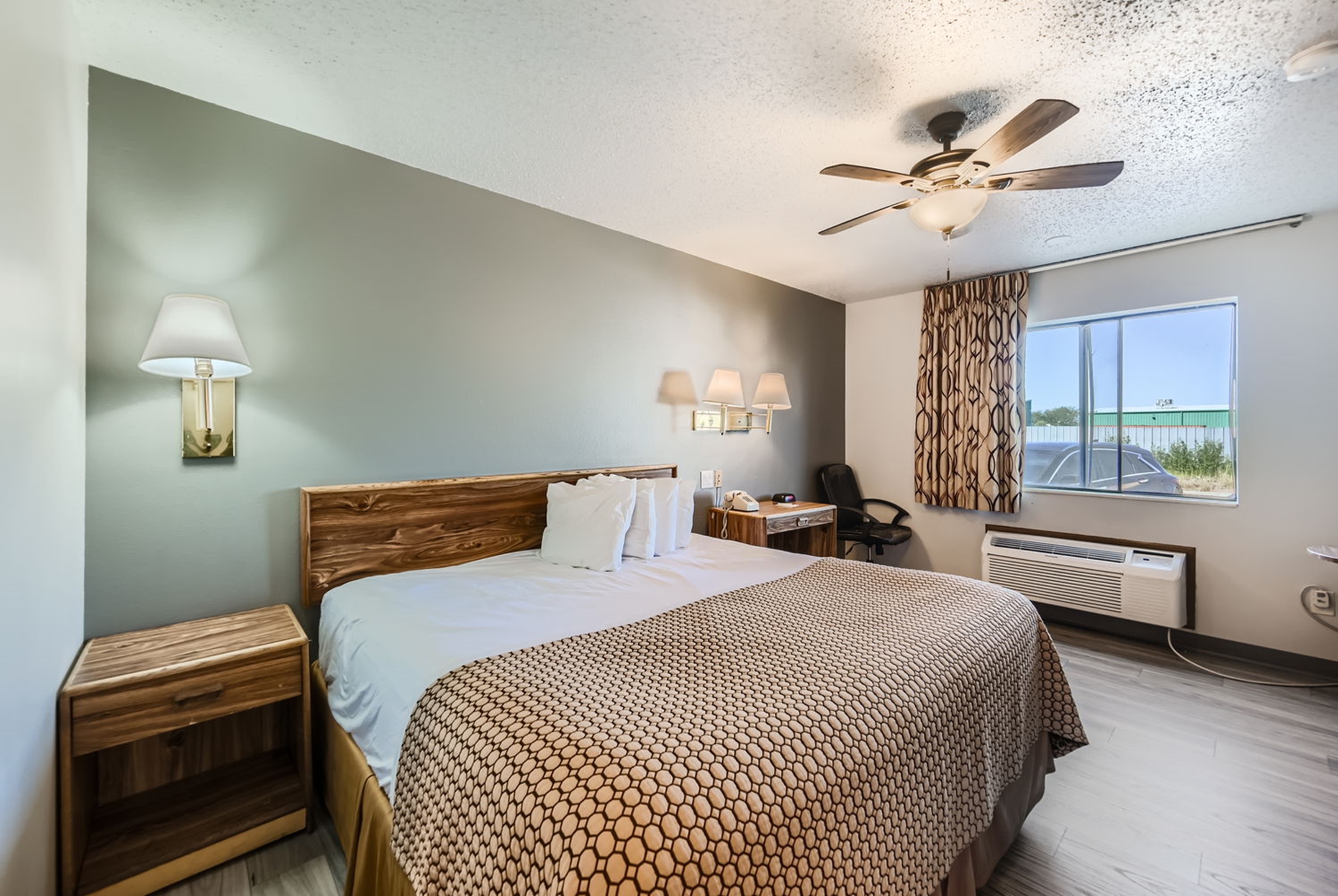 Guest room at the Travelodge by Wyndham Longmont in Longmont, Colorado