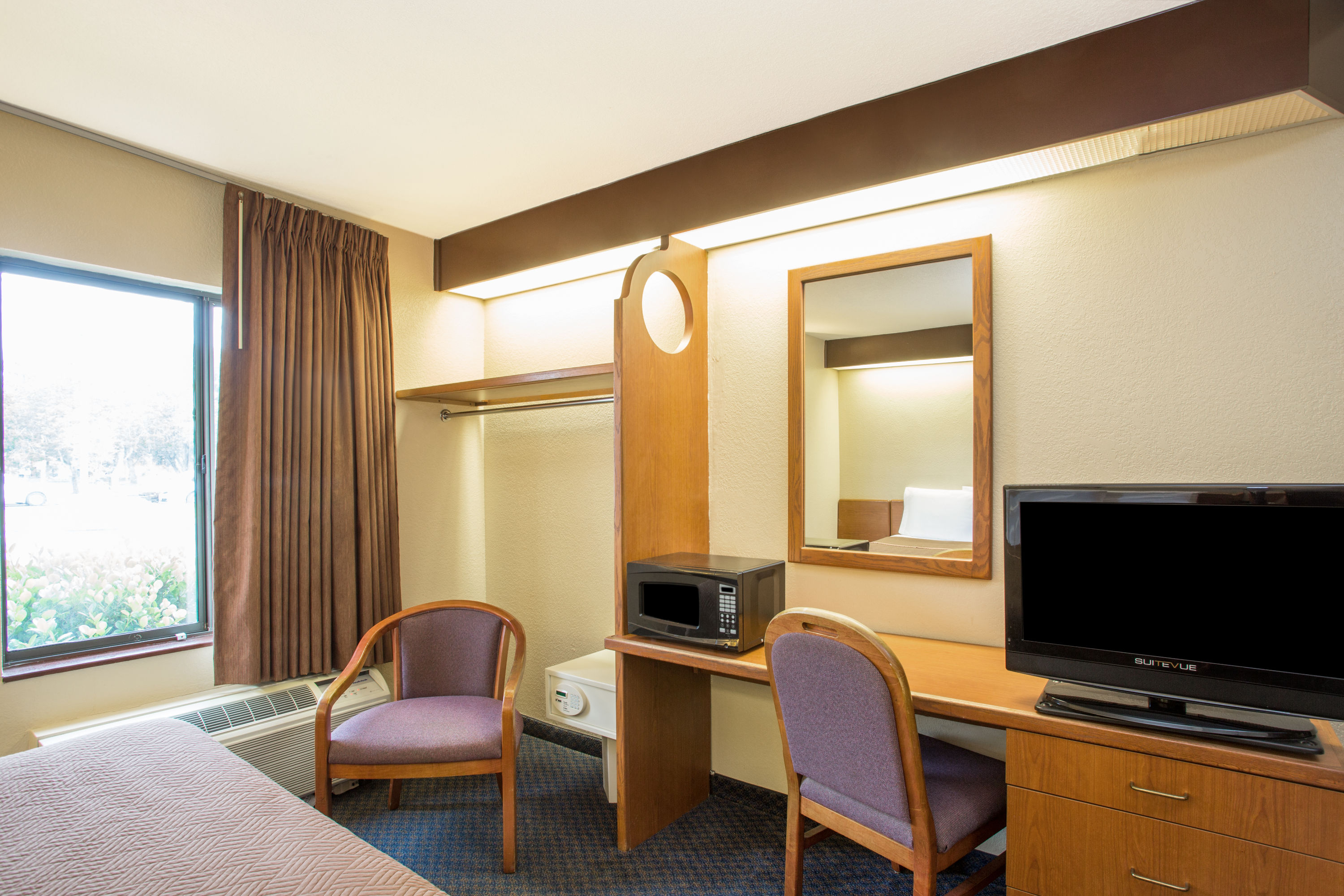 Guest room at the Travelodge by Wyndham Fort Myers Airport in Fort Myers, Florida