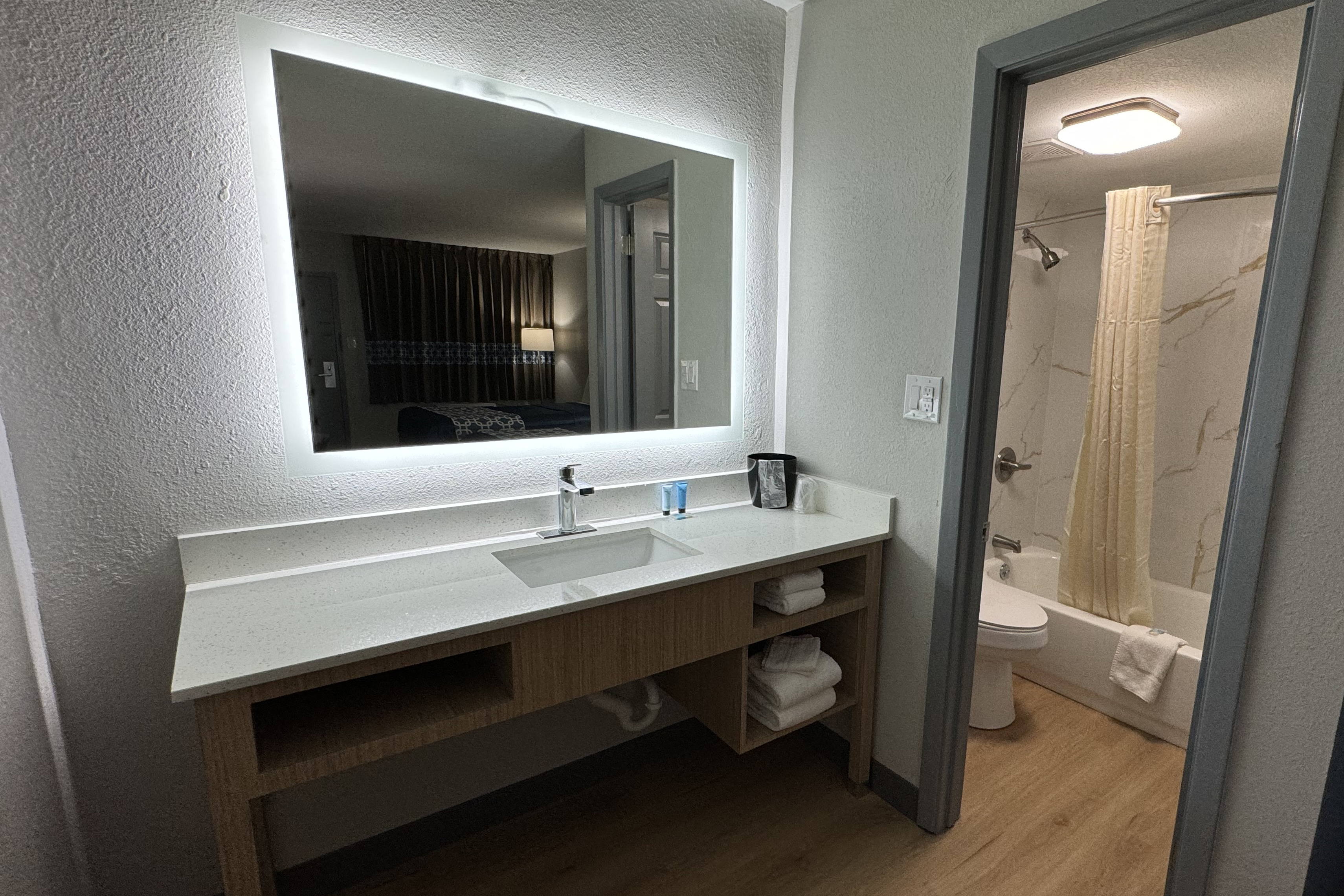Guest room bath at the Travelodge by Wyndham Gainesville in Gainesville, Florida