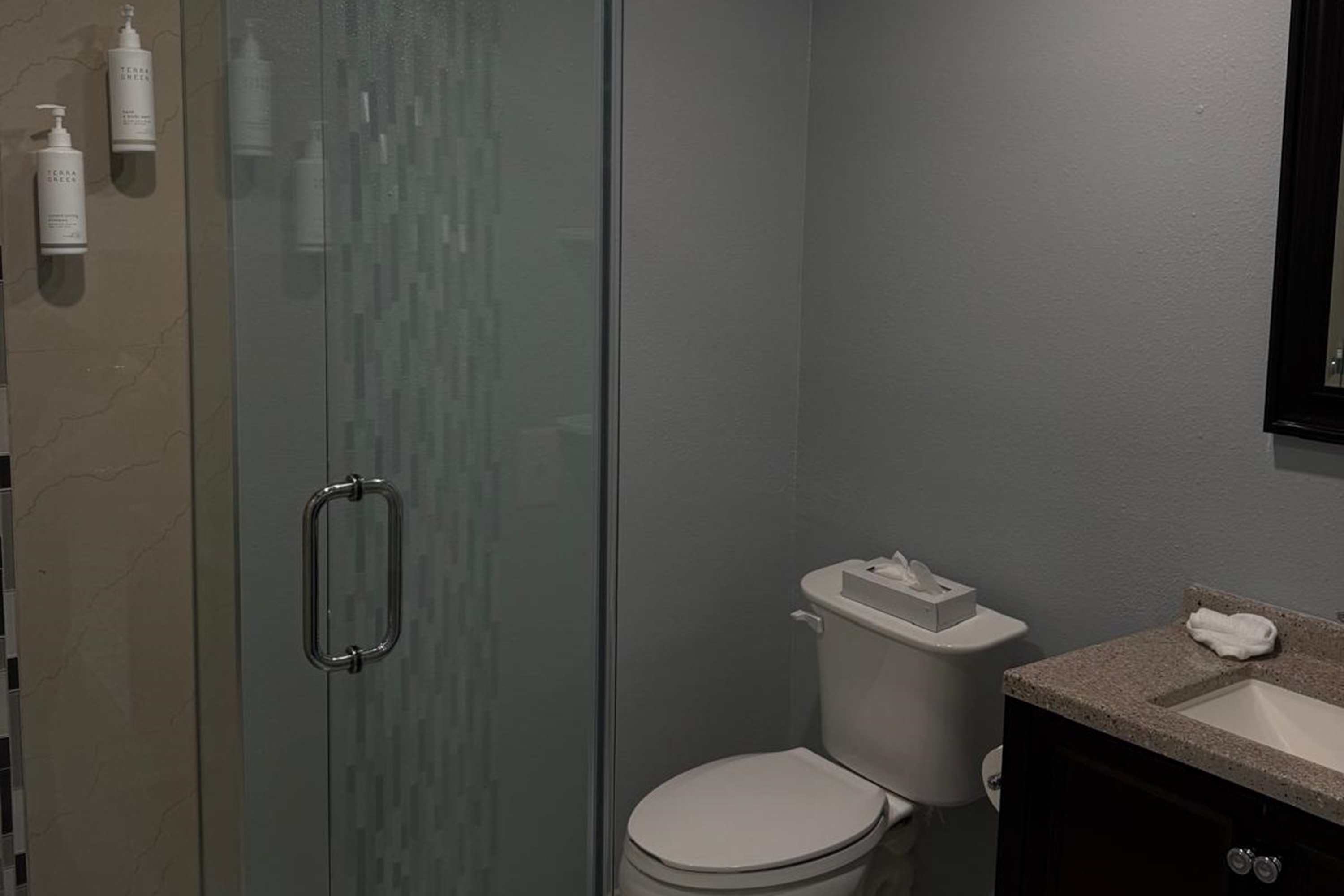 Guest room bath at the Travelodge by Wyndham Lakeland in Lakeland, Florida