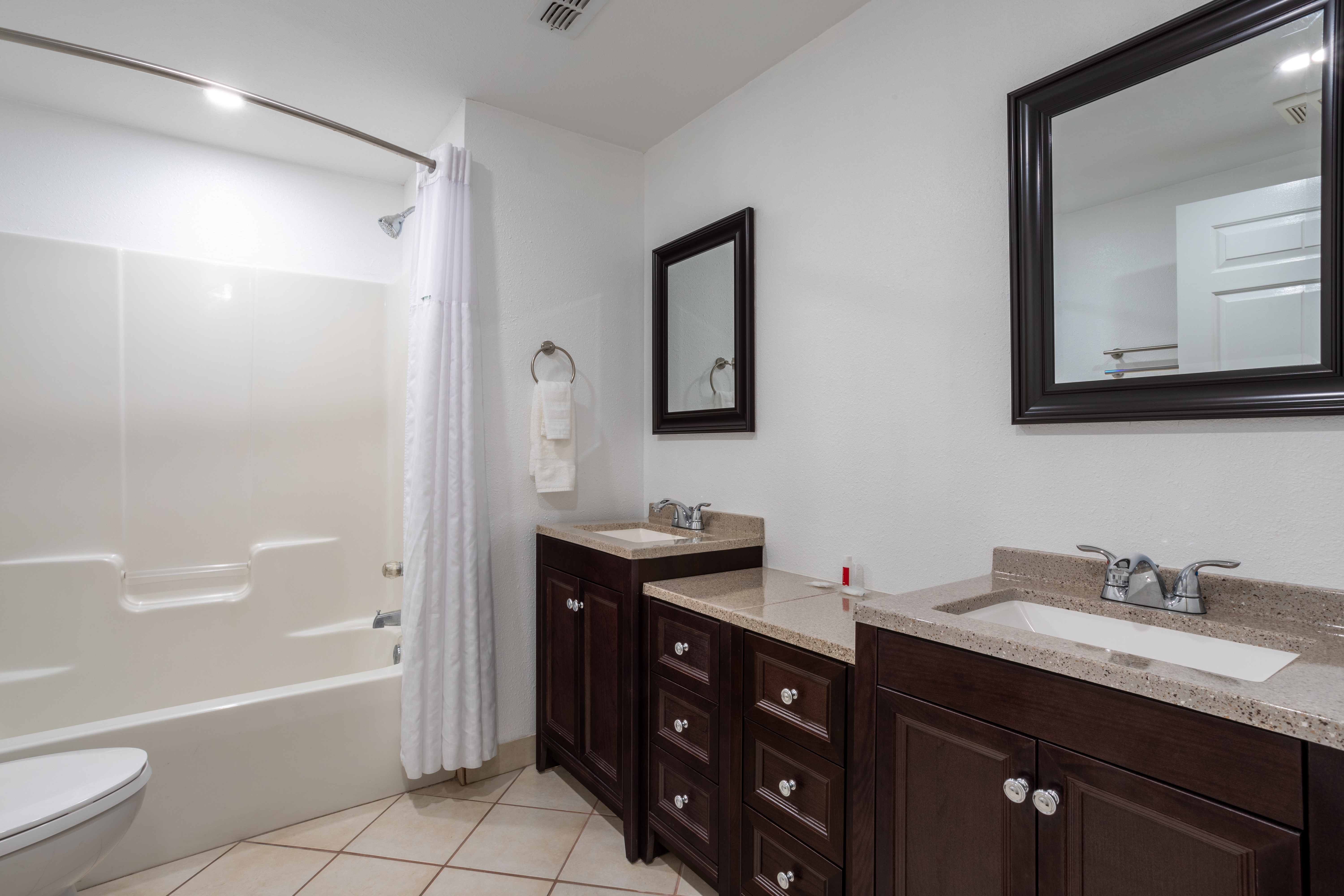Guest room bath at the Travelodge by Wyndham Lakeland in Lakeland, Florida