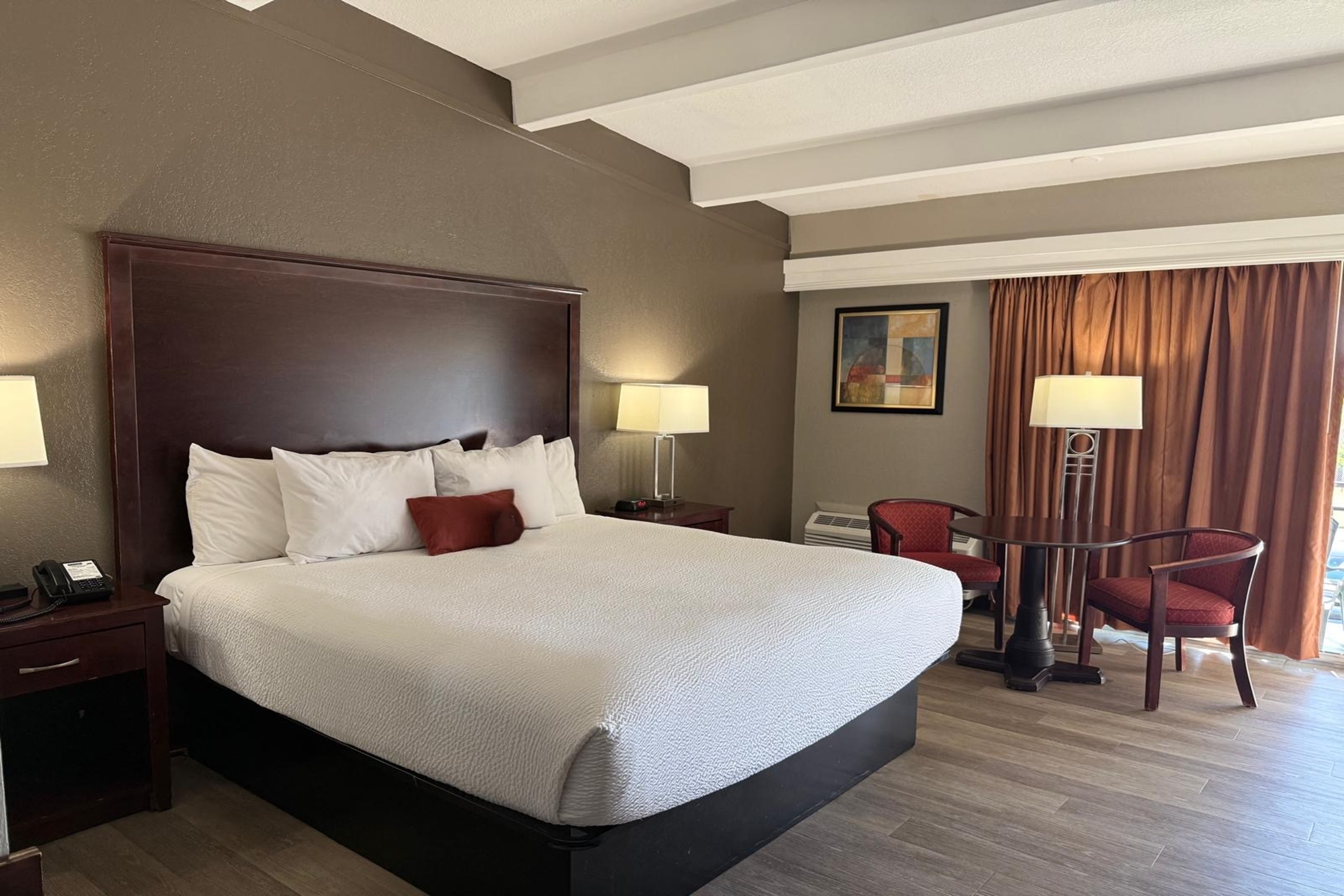 Guest room at the Travelodge by Wyndham Lakeland in Lakeland, Florida