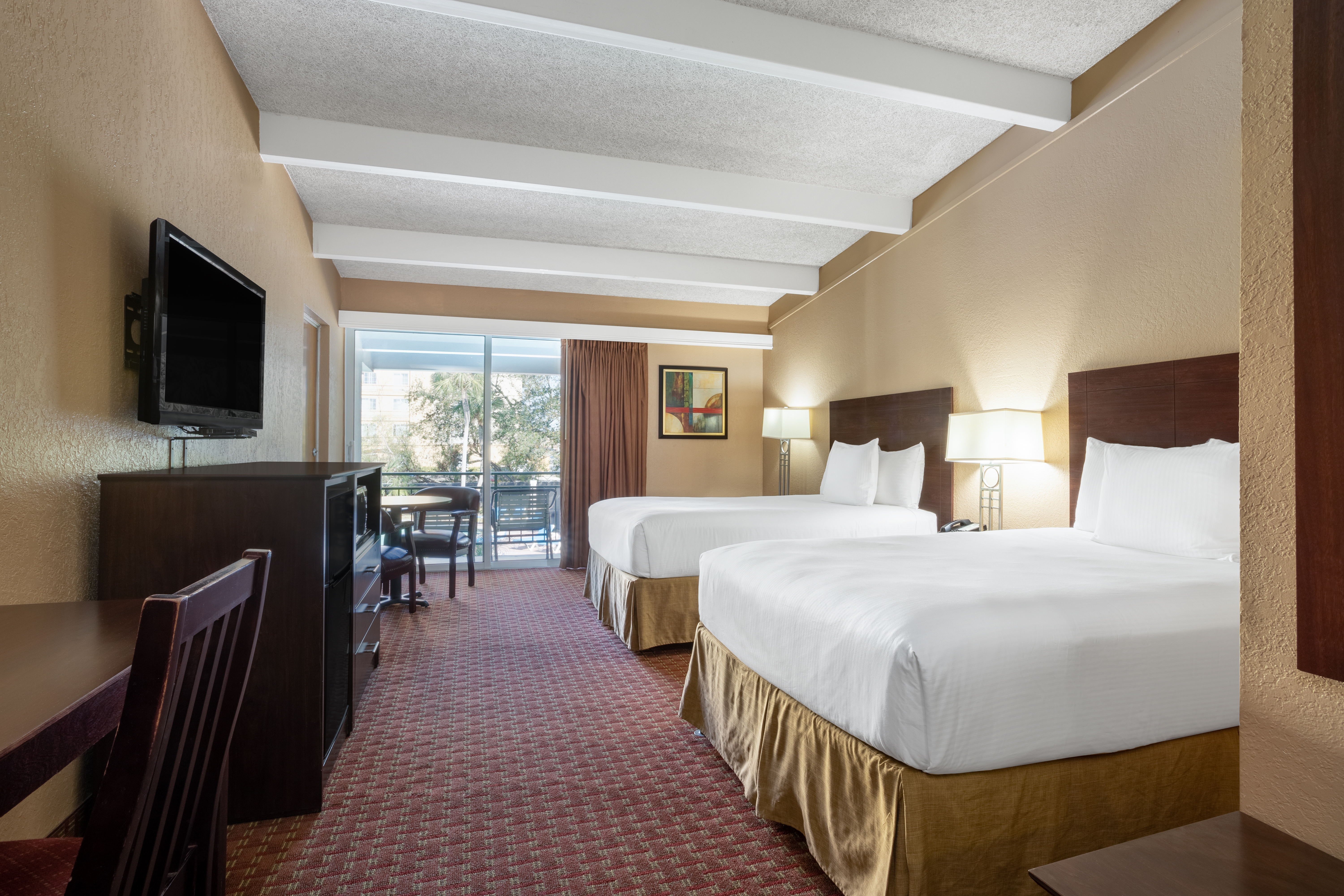 Guest room at the Travelodge by Wyndham Lakeland in Lakeland, Florida