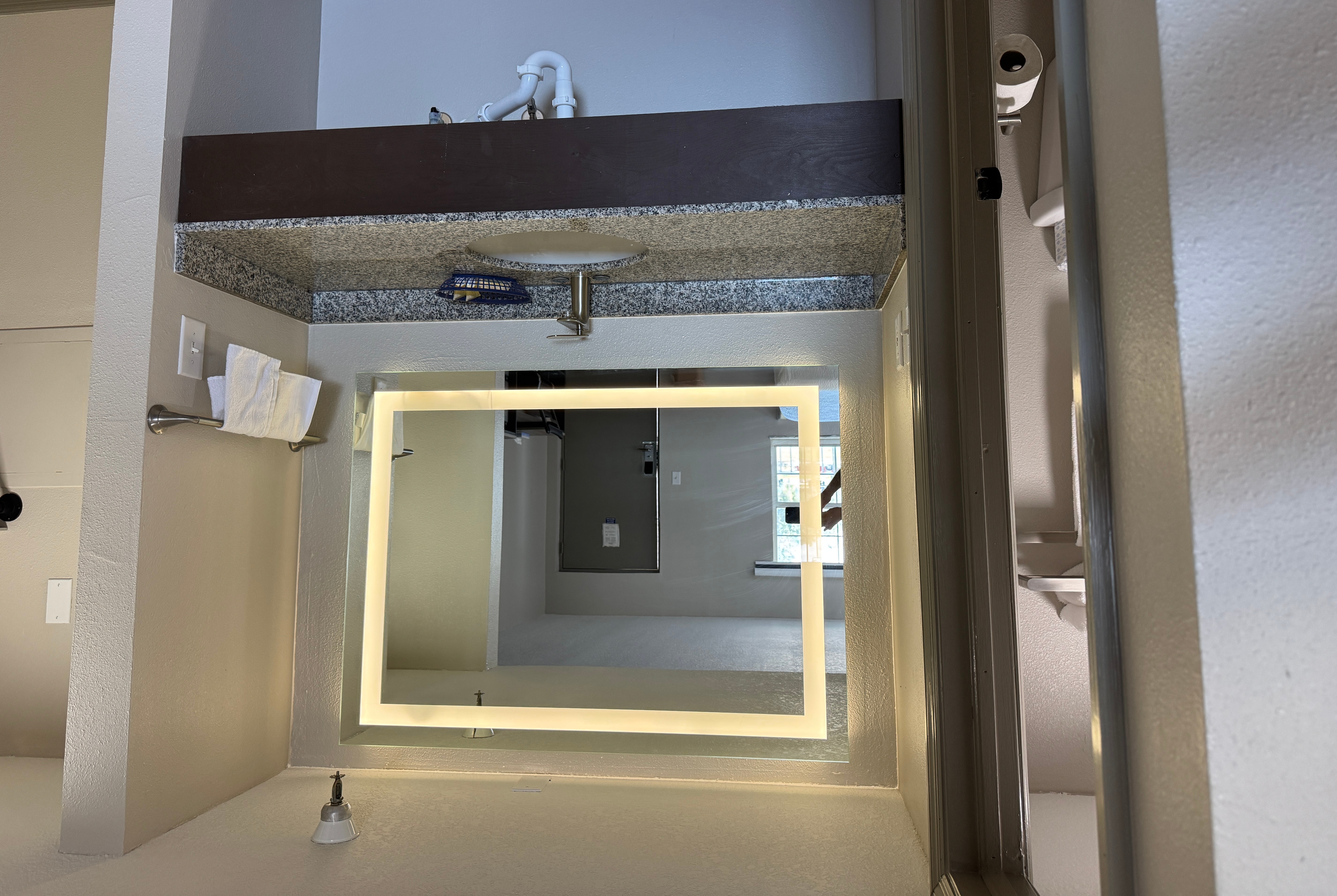 Guest room bath at the Travelodge by Wyndham Venice in Venice, Florida