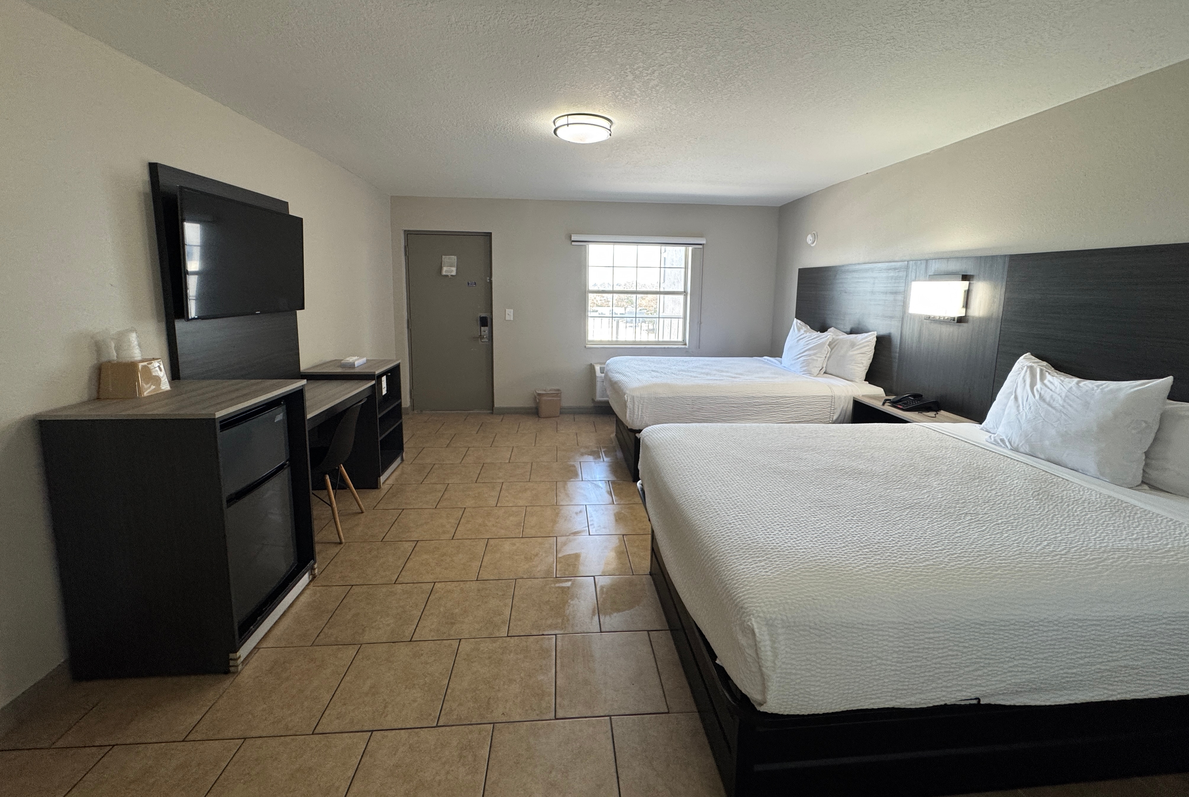 Guest room at the Travelodge by Wyndham Venice in Venice, Florida